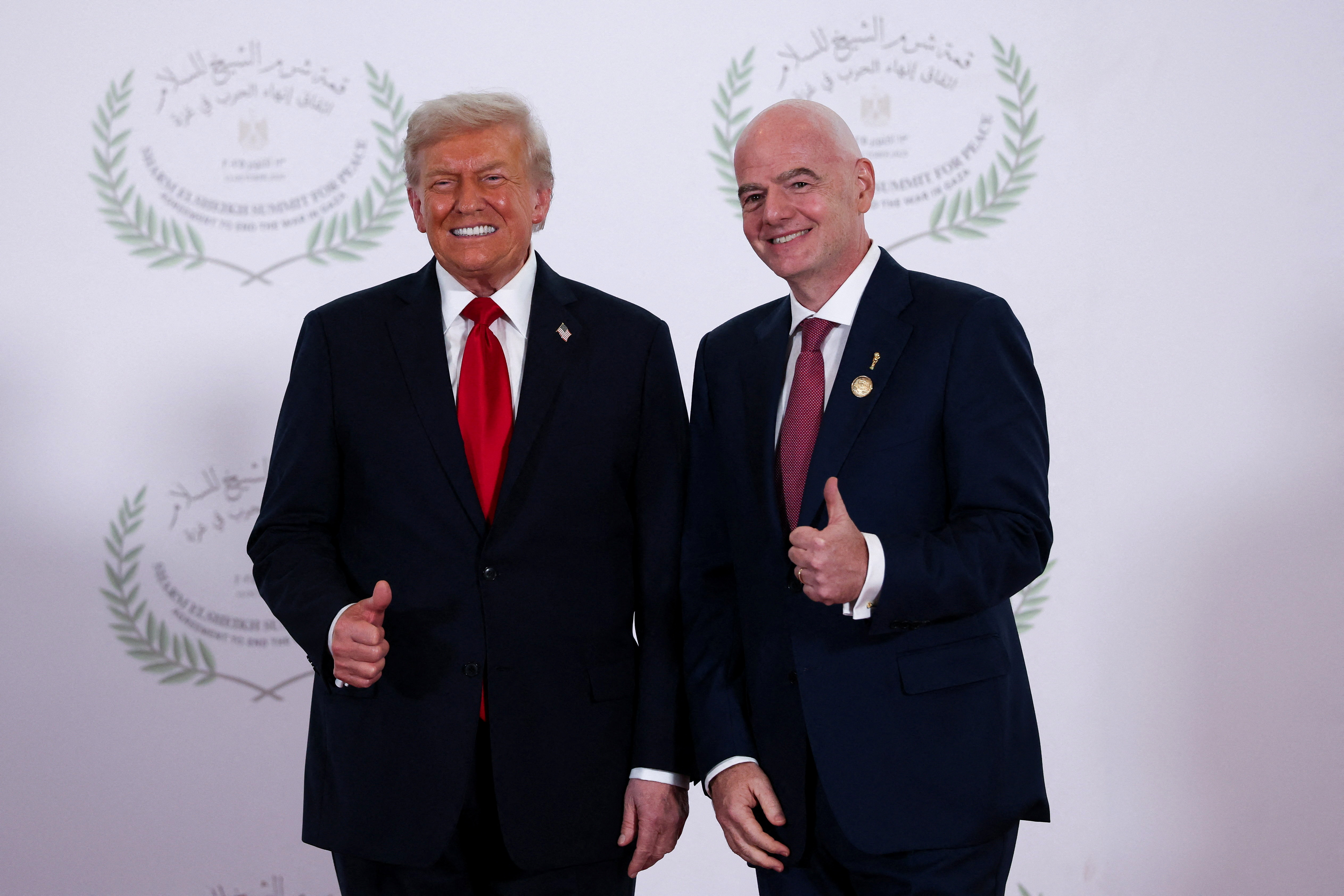 SHARM EL-SHEIKH, EGYPT - OCTOBER 13: U.S. President Donald Trump and FIFA president Gianni Infantino pose for a photo, at a world leaders' summit on ending the Gaza war on October 13, 2025 in Sharm El-Sheikh, Egypt. President Trump is in Egypt to meet with European and Middle Eastern leaders in what’s being billed as an international peace summit, following the start of a US-brokered ceasefire deal to end the war in the Gaza Strip. (Photo by Suzanne Plunkett - Pool / Getty Images)