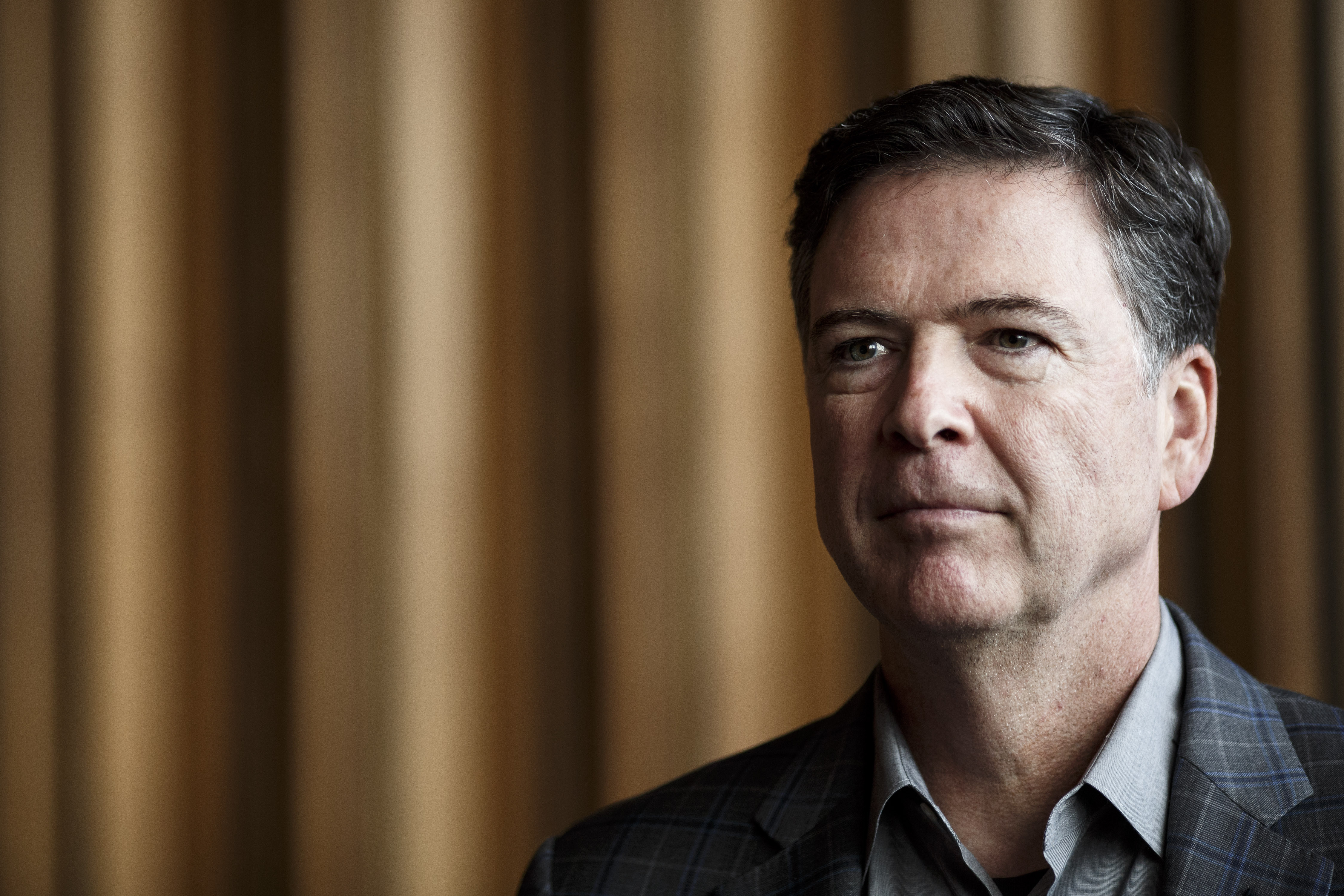 BERLIN, GERMANY - JUNE 19: Former FBI Director James Comey talks backstage before a panel discussion about his book "A Higher Loyalty" on June 19, 2018 in Berlin, Germany. Comey is in Berlin at the invitation of the American Academy in Berlin. (Photo by Carsten Koall/Getty Images)