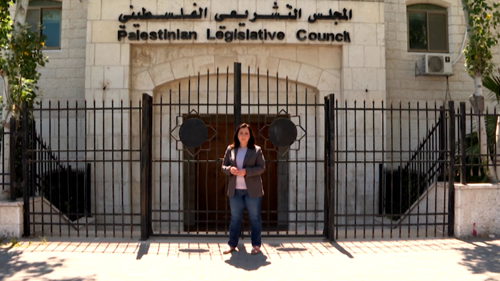 Al Jazeera’s Nour Odeh reports in front of Palestinian legislative council.
