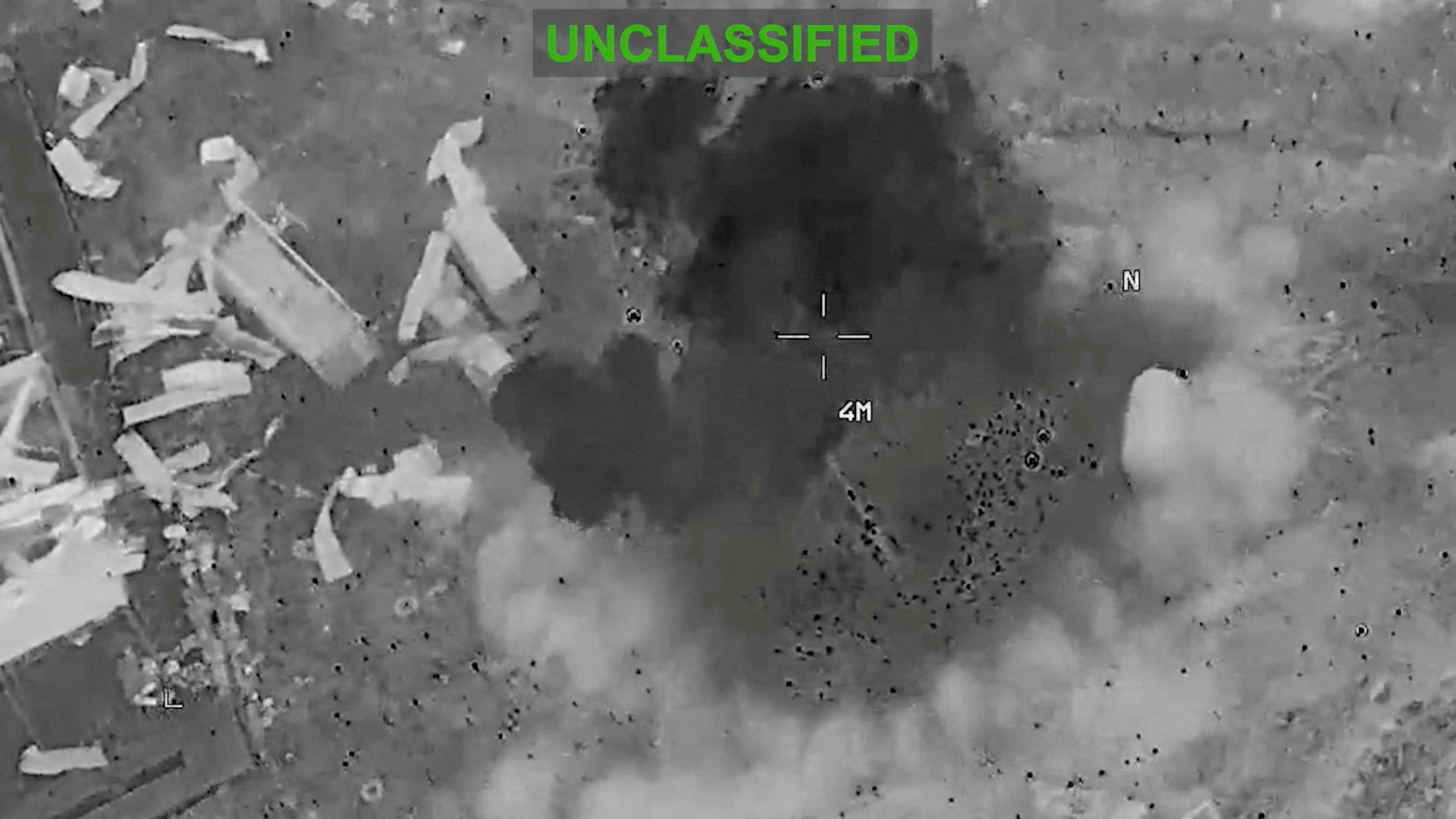 Scattered debris and smoke, at an unknown location, during what the U.S. Central Command (CENTCOM) says are strikes on Iran, in this screengrab taken from a handout video released on July 22, 2026. U.S. Central Command/Handout via REUTERS THIS IMAGE HAS BEEN SUPPLIED BY A THIRD PARTY. MANDATORY CREDIT. OVERLAY AND MASKING FROM SOURCE. REFILE - REMOVING EXTRA WORD "FOLLOWING". VERIFICATION: - Location and date could not be verified. - No earlier version of the video found posted online before Wednesday (July 22). [Reuters]