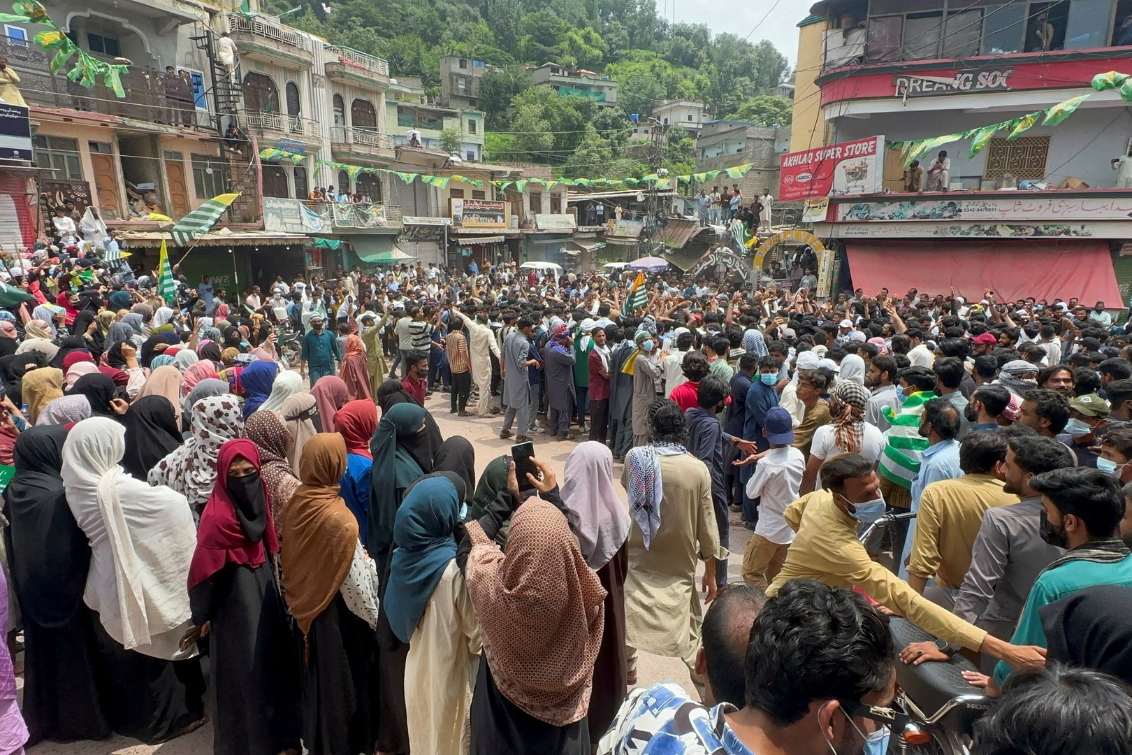 People gather in support of a protest by the banned Joint Awami Action Committee (JAAC), an alliance of civil society groups, during a demonstration in Kotli, Pakistani Kashmir, July 30, 2026. Picture taken with a mobile phone. [REUTERS/Stringer]