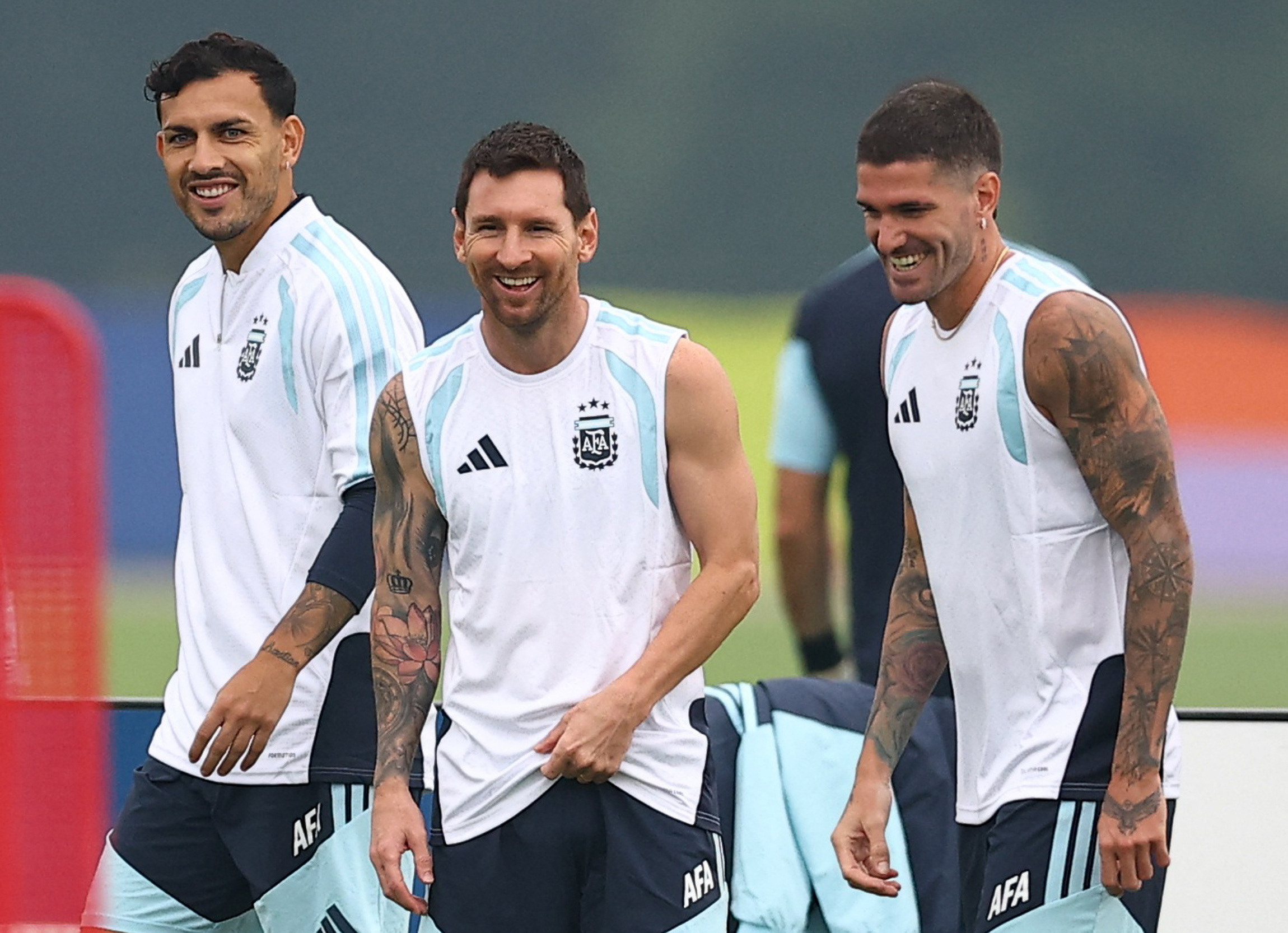 Argentina's Rodrigo De Paul, Lionel Messi and Leandro Paredes during training