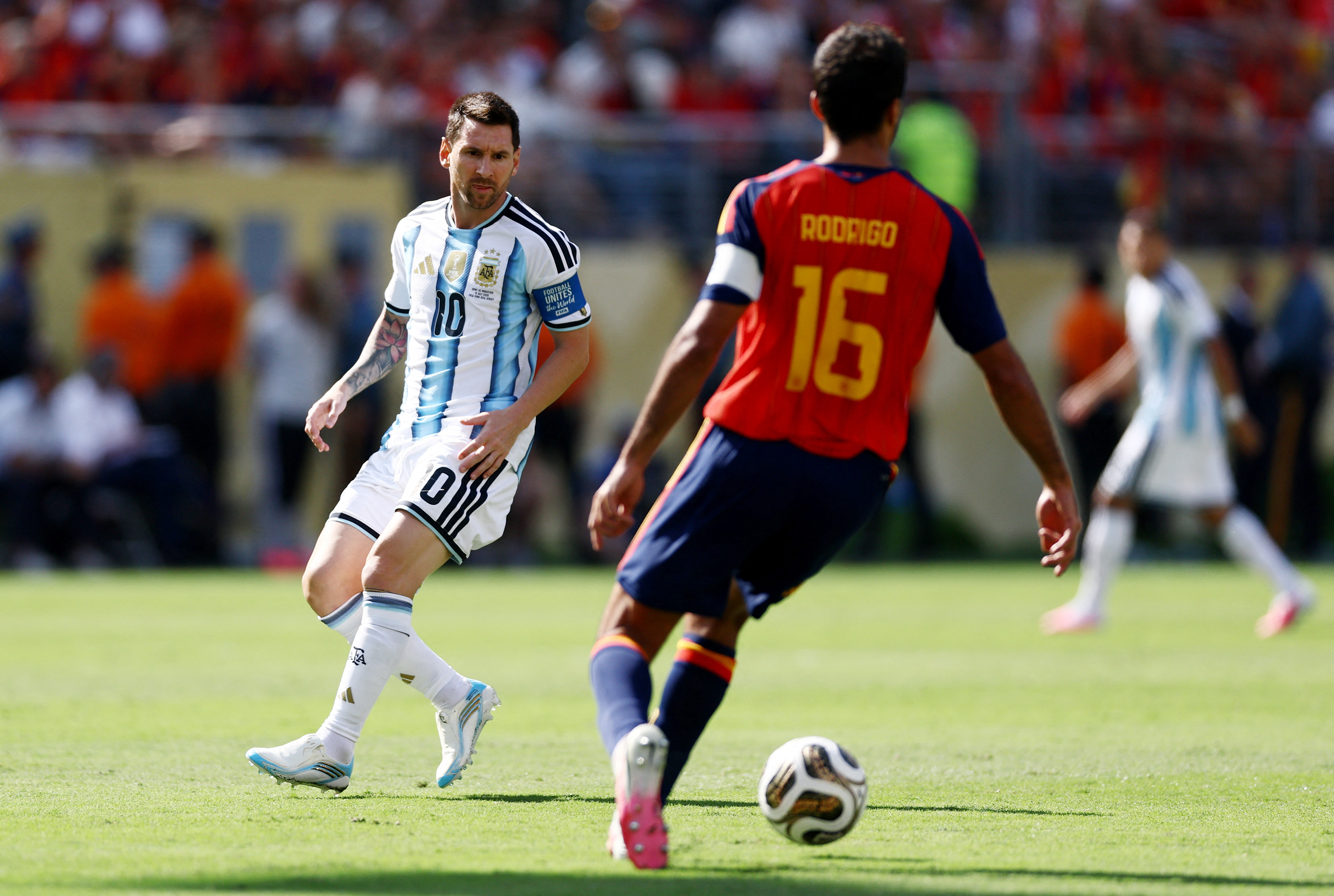 Soccer Football - FIFA World Cup 2026 - Final - Spain v Argentina - New York/New Jersey Stadium, East Rutherford, New Jersey, U.S. - July 19, 2026 Argentina's Lionel Messi in action with Spain's Rodri REUTERS/Lee Smith