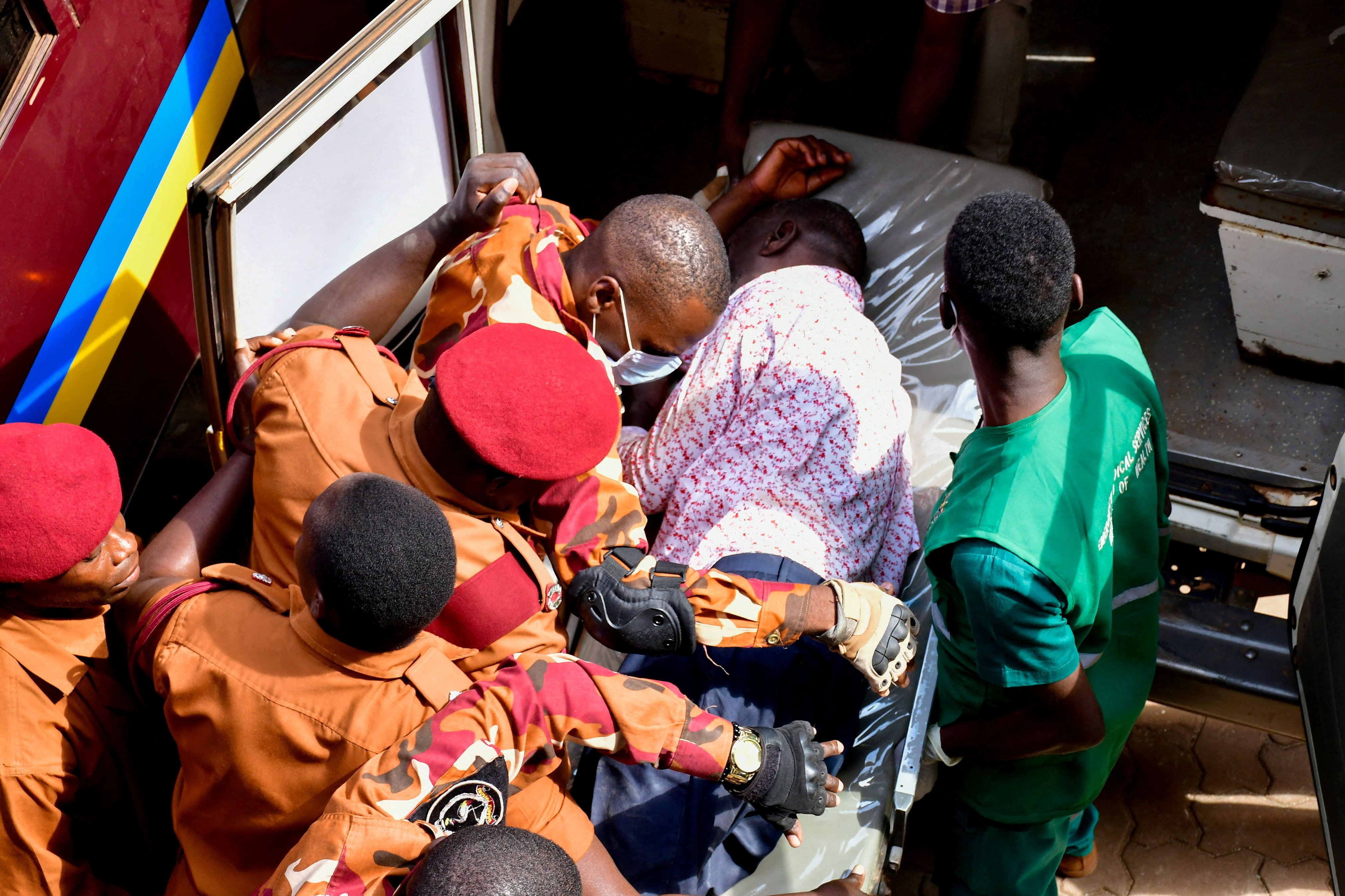 Detained Ugandan opposition figure Kizza Besigye is put in an ambulance after he collapsed while attending a court session where he is on trial for treason, at the High court in Kampala, Uganda, July 29, 2026. REUTERS/Abubaker Lubowa TPX IMAGES OF THE DAY