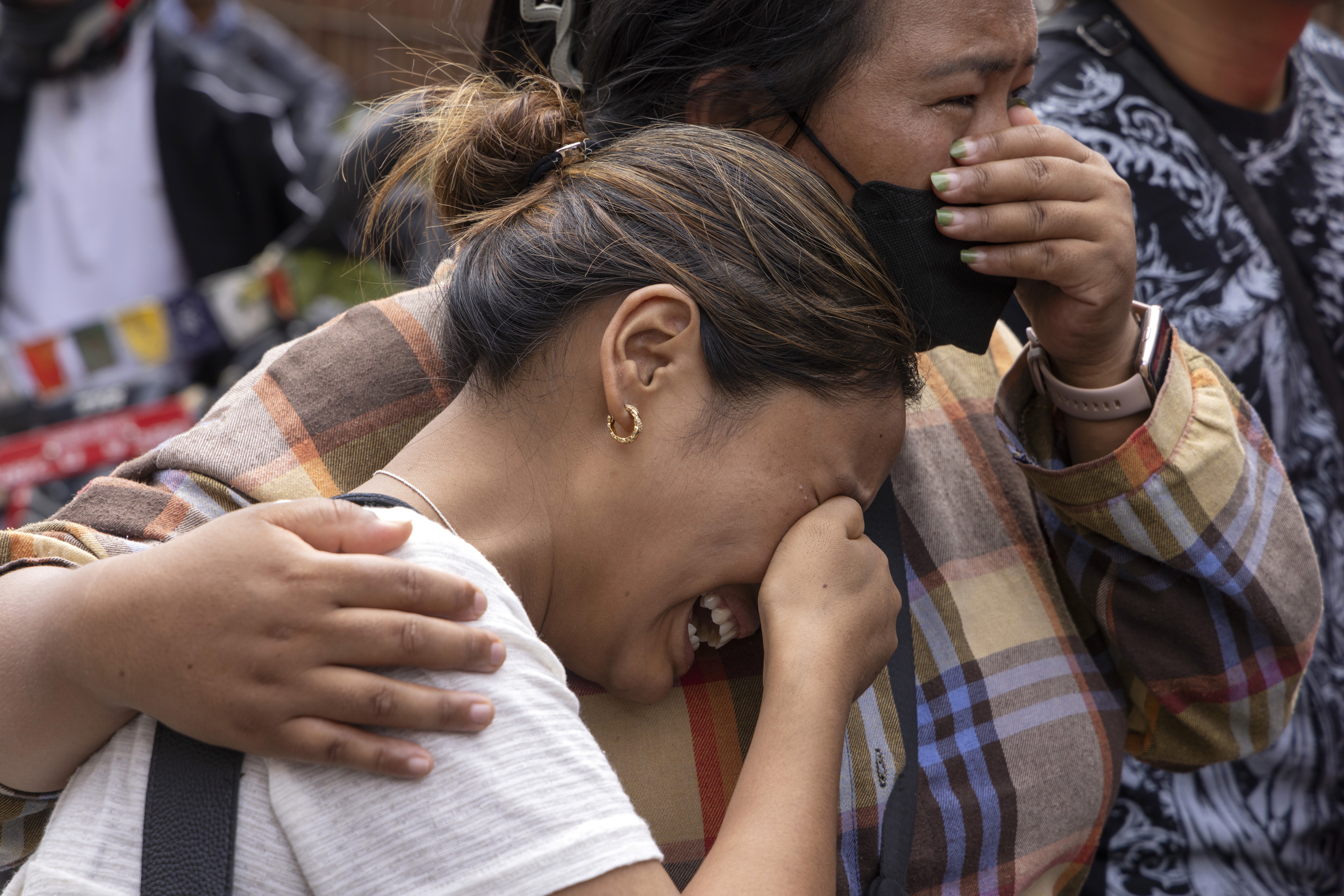 Relatives of victims and missing people react outside the morgue of the Tribhuvan University Teaching Hospital (TUTH), in Kathmandu, Nepal, August 29, 2026