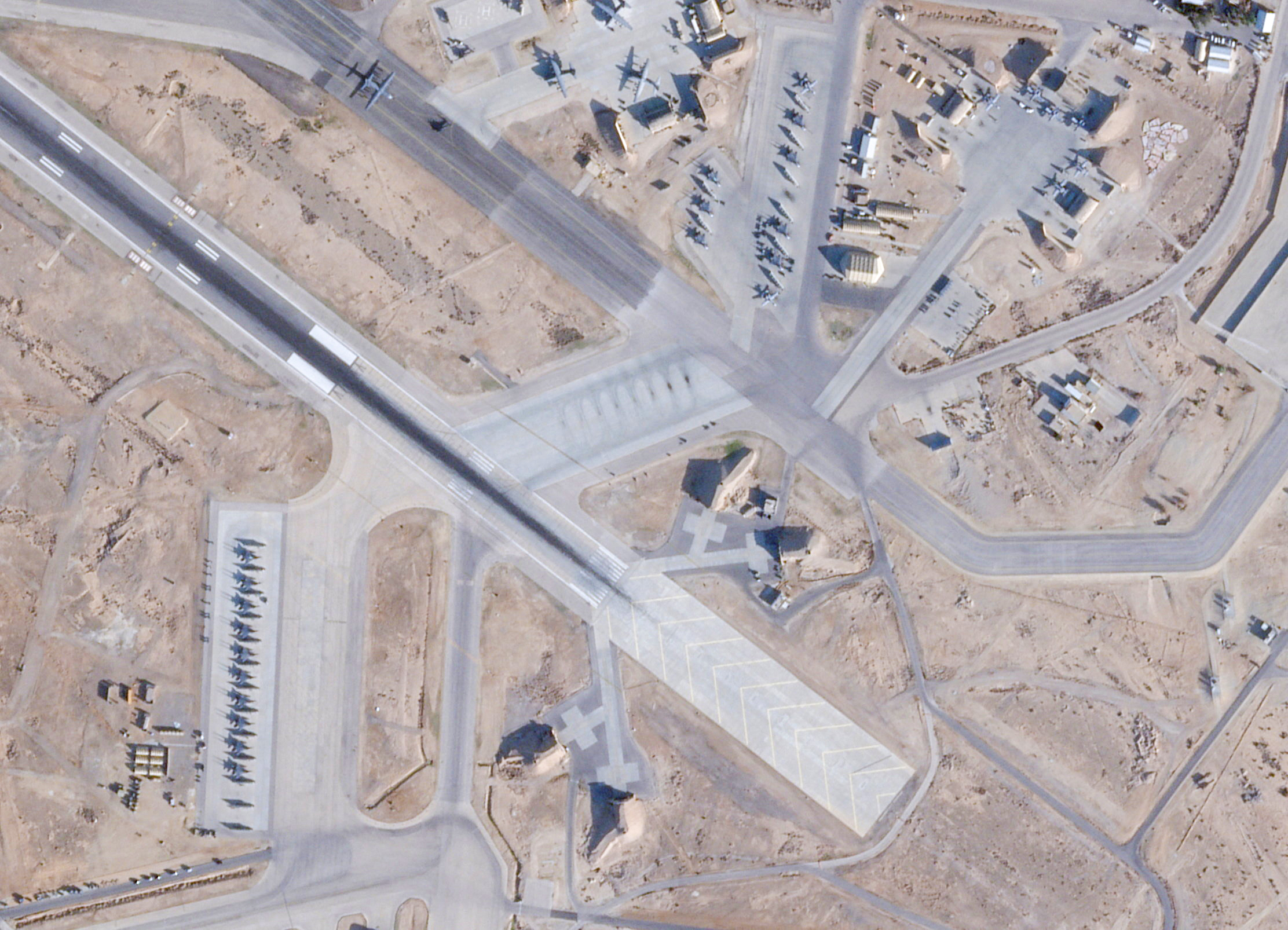 Satellite image shows F-15E, A-10 Thunderbolt, and C-130 Hercules at an airbase.