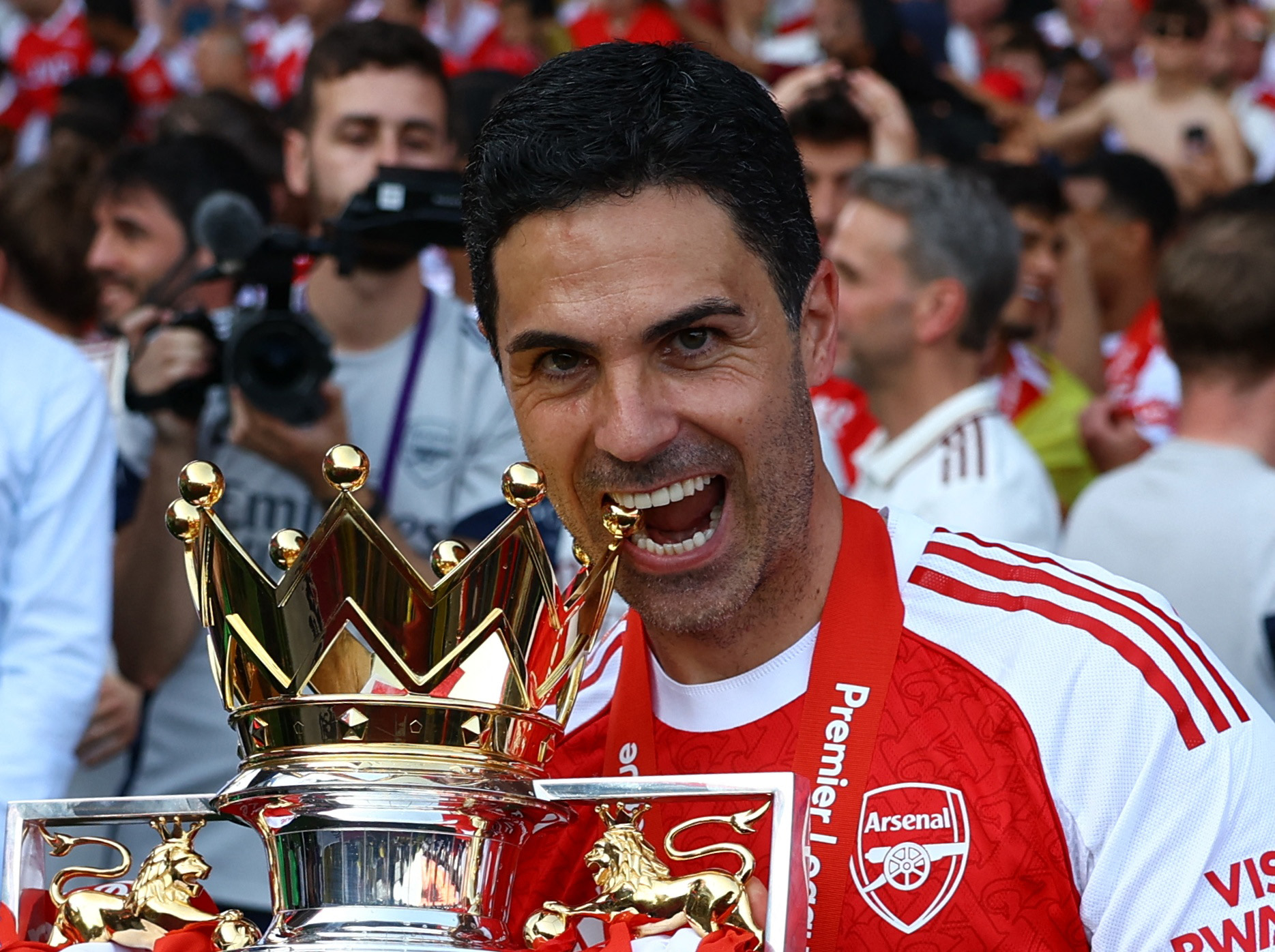 Arsenal manager Mikel Arteta celebrates with the trophy.