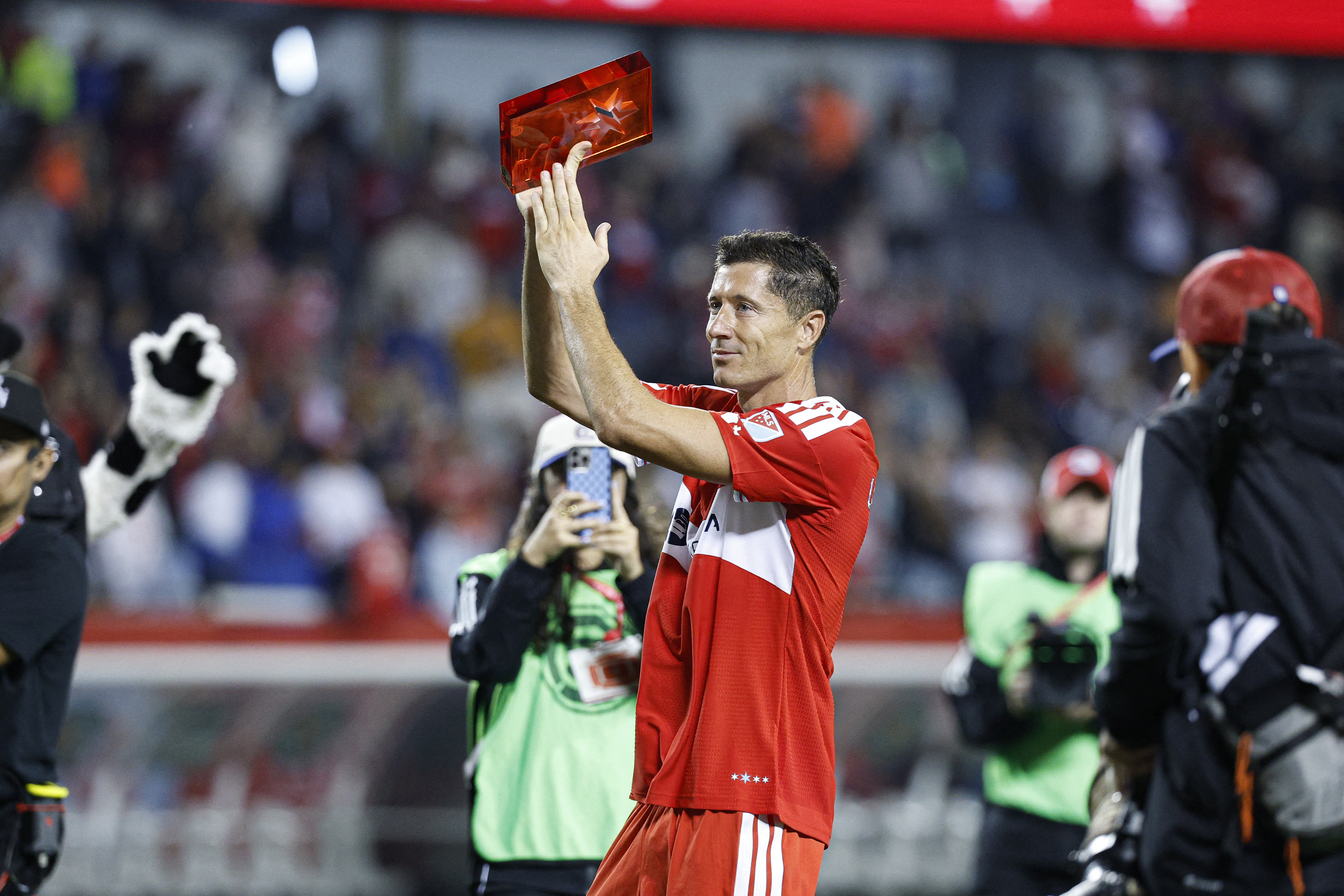 Chicago Fire forward Robert Lewandowski celebrates after his debut MLS game against Charlotte FC at Soldier Field
