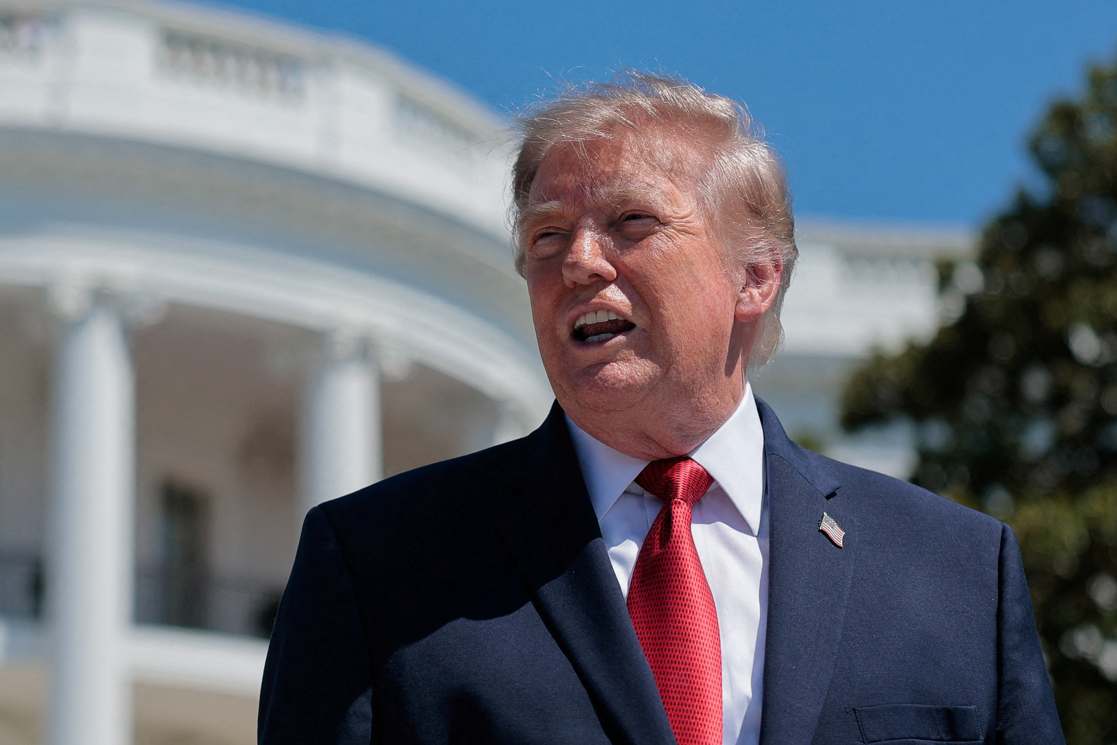 U.S. President Donald Trump speaks to reporters about the helipad being constructed on the South Lawn, at the White House in Washington, D.C., U.S., August 19, 2026. REUTERS/Kylie Cooper