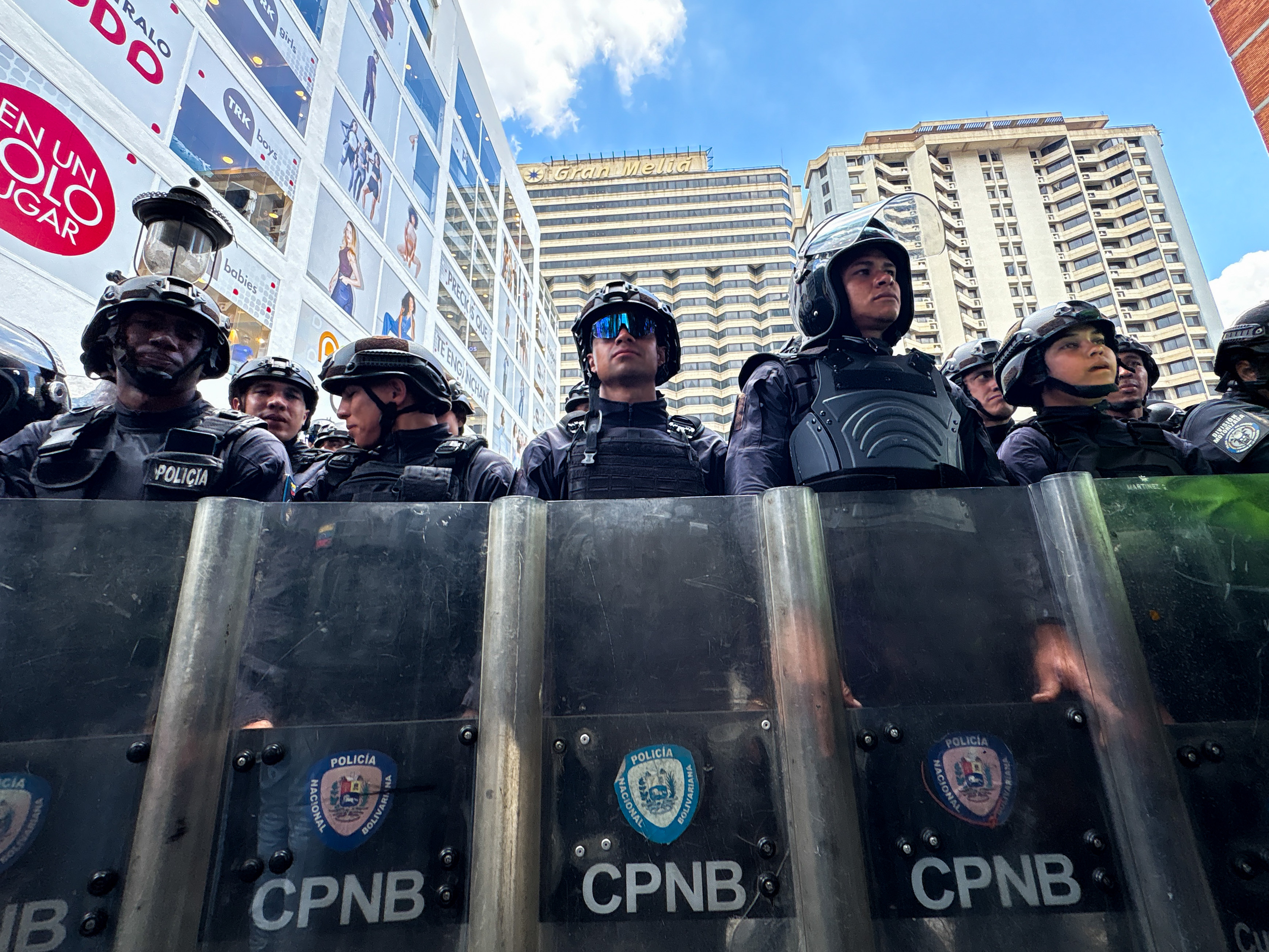 A line of police officers outside the Venezuela government-opposition talks