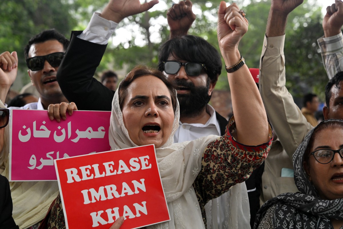 Pakistan Tehreek-e-Insaf (PTI) party supporter shout slogans during a protest demanding the release of their jailed leader and the country's former Prime Minister Imran Khan, in Lahore