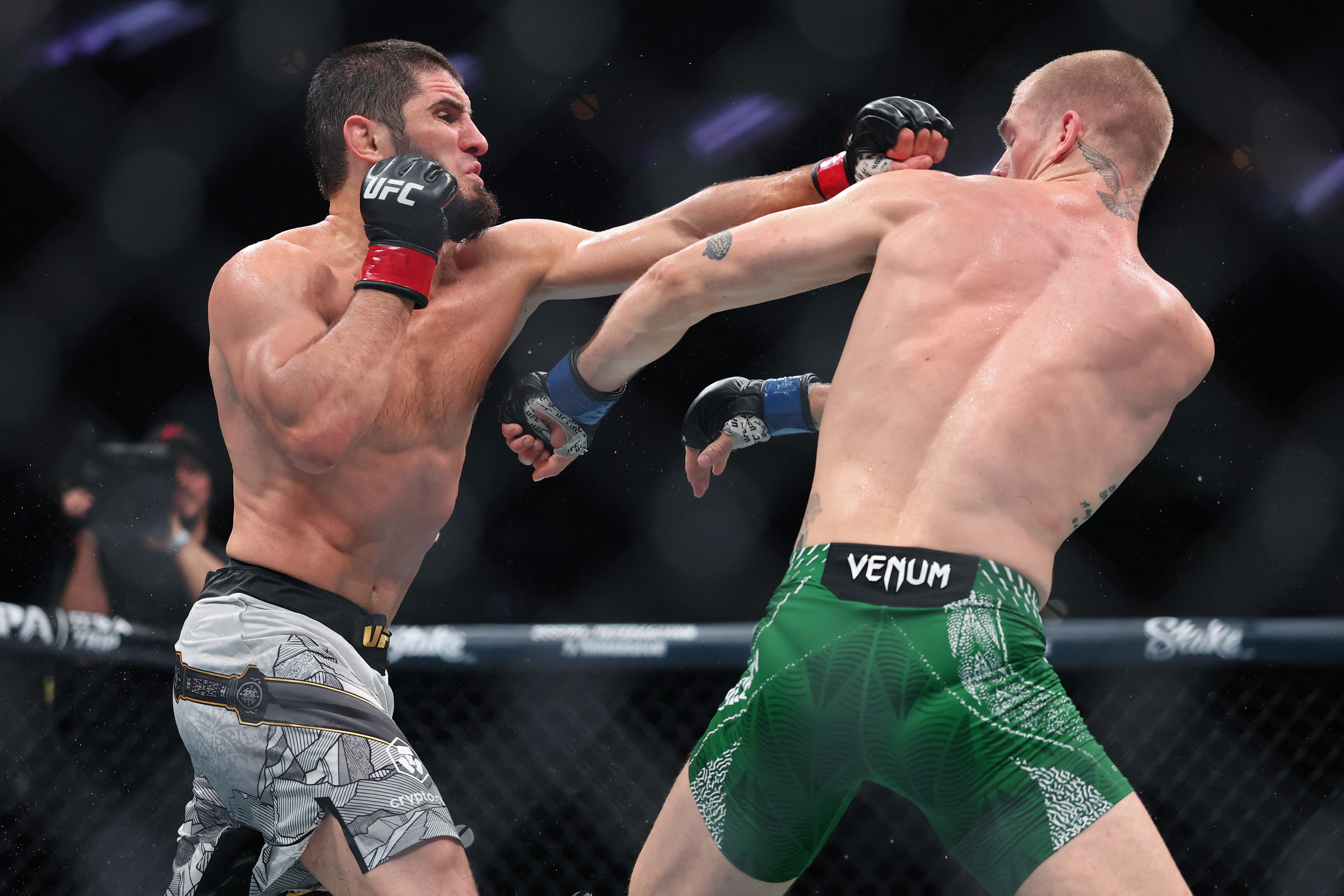 Makhachev punches Ian Machado Garry, right, in their welterweight title bout during UFC 330 at Xfinity Mobile Arena on August 15, 2026, in Philadelphia, Pennsylvania, US