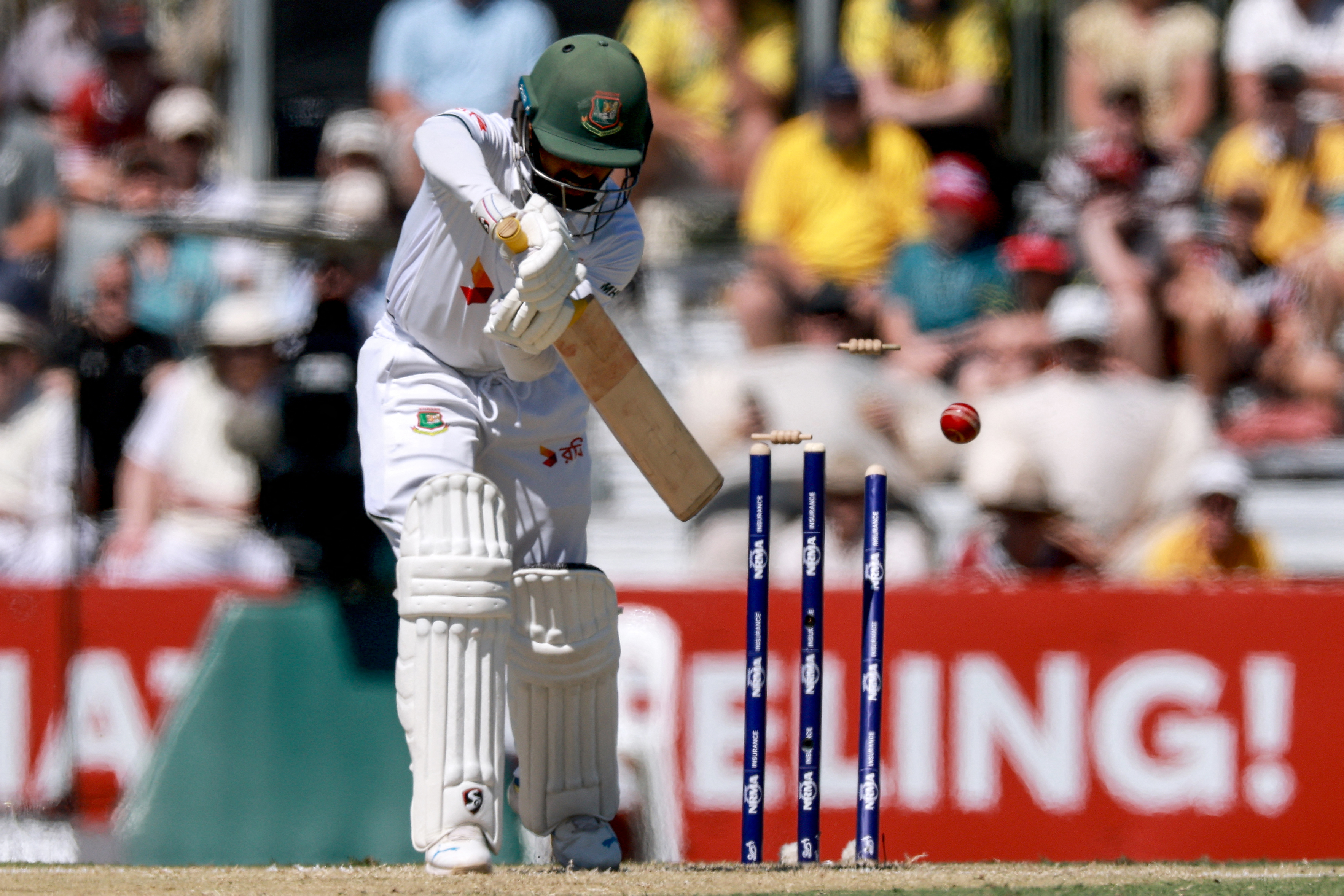 Bangladeshs Mominul Haque is bowled by Australias Mitchell Starc during the second day of the second cricket Test match between Australia and Bangladesh at the Great Barrier Reef Stadium in Mackay on August 23, 2026. (Photo by DAVID GRAY / AFP) / -- IMAGE RESTRICTED TO EDITORIAL USE - STRICTLY NO COMMERCIAL USE --