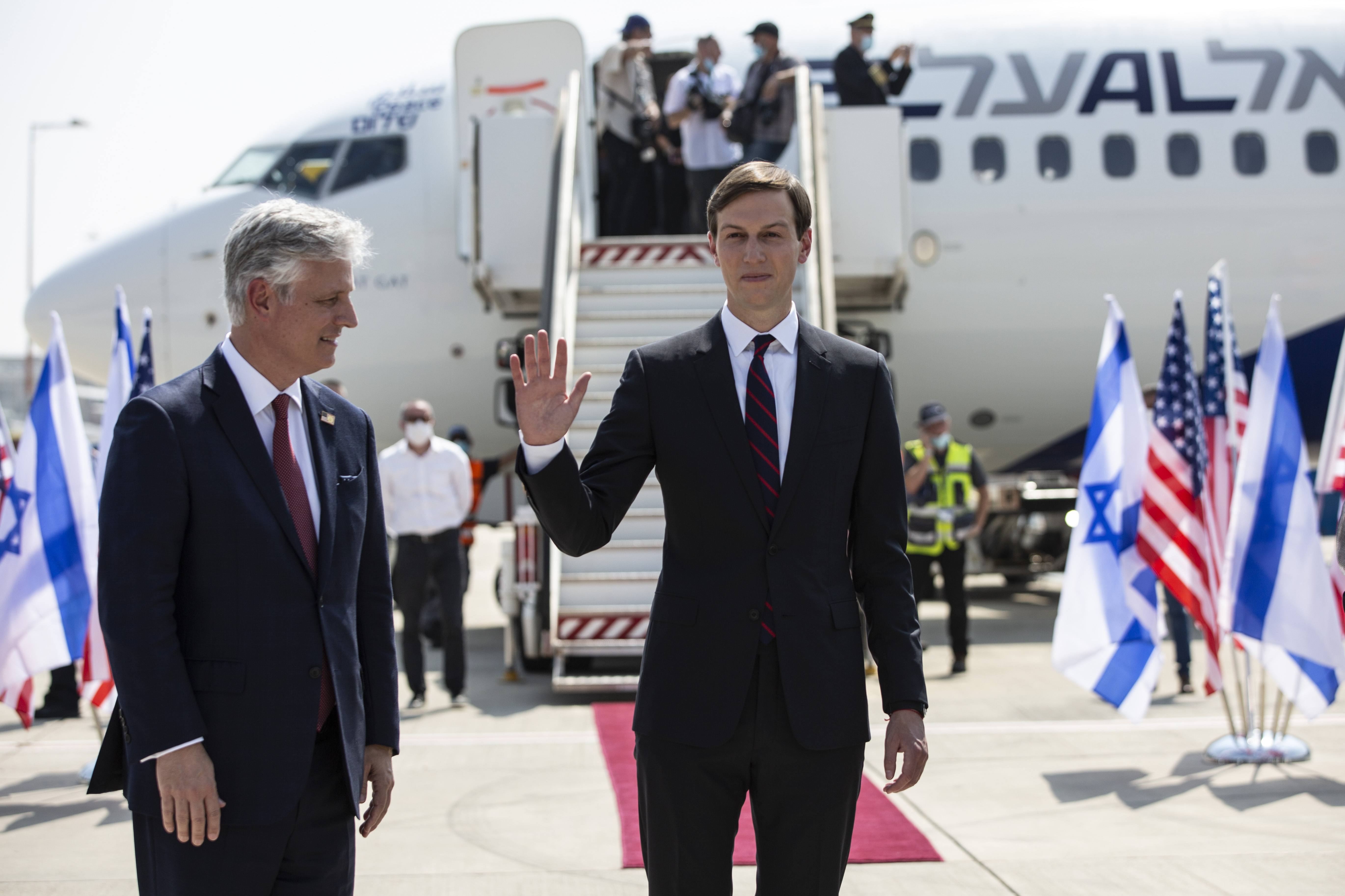 U.S. President Donald Trump’s senior adviser and son-in-law Jared Kushner, center, waves while standing with national security adviser Robert O’Brien before their departure to Abu Dhabi, at Ben-Gurion Airport, in Lod, near Tel Aviv, Israel, Monday, Aug. 31, 2020. (Heidi Levine/Pool via AP).