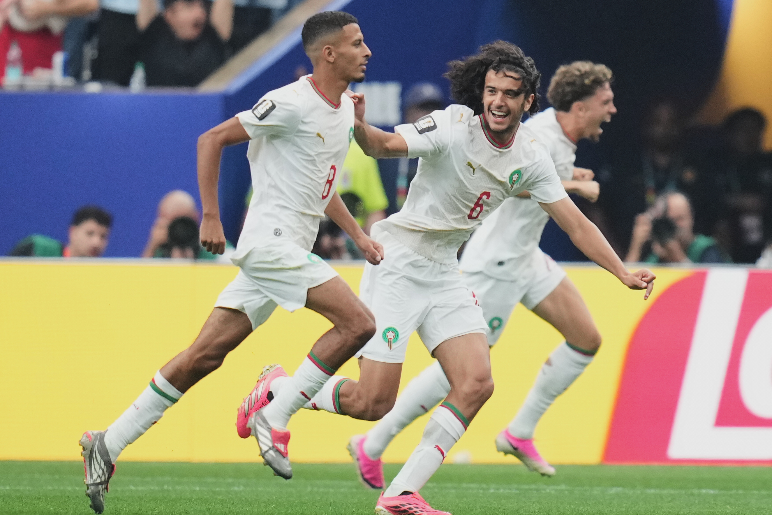 Morocco's Azzedine Ounahi, left, celebrates scoring his side's opening goal with Ayyoub Bouaddi during the World Cup round of 16 soccer match between Canada and Morocco in Houston, Saturday, July 4, 2026. (AP Photo/Eric Gay)