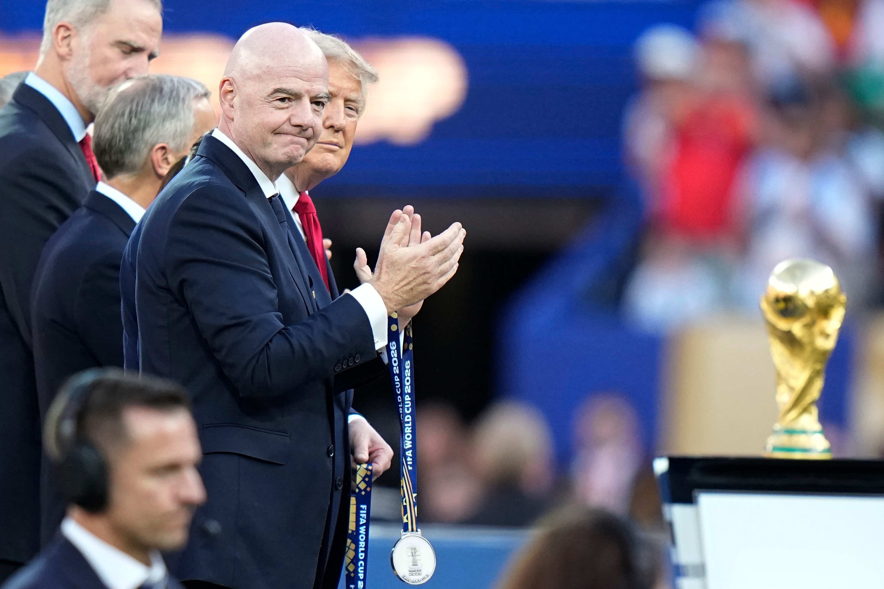 US President Donald J Trump and FIFA President Gianni Infantino applaud to welcome the players during the presentation ceremony after the 2026 World Cup final