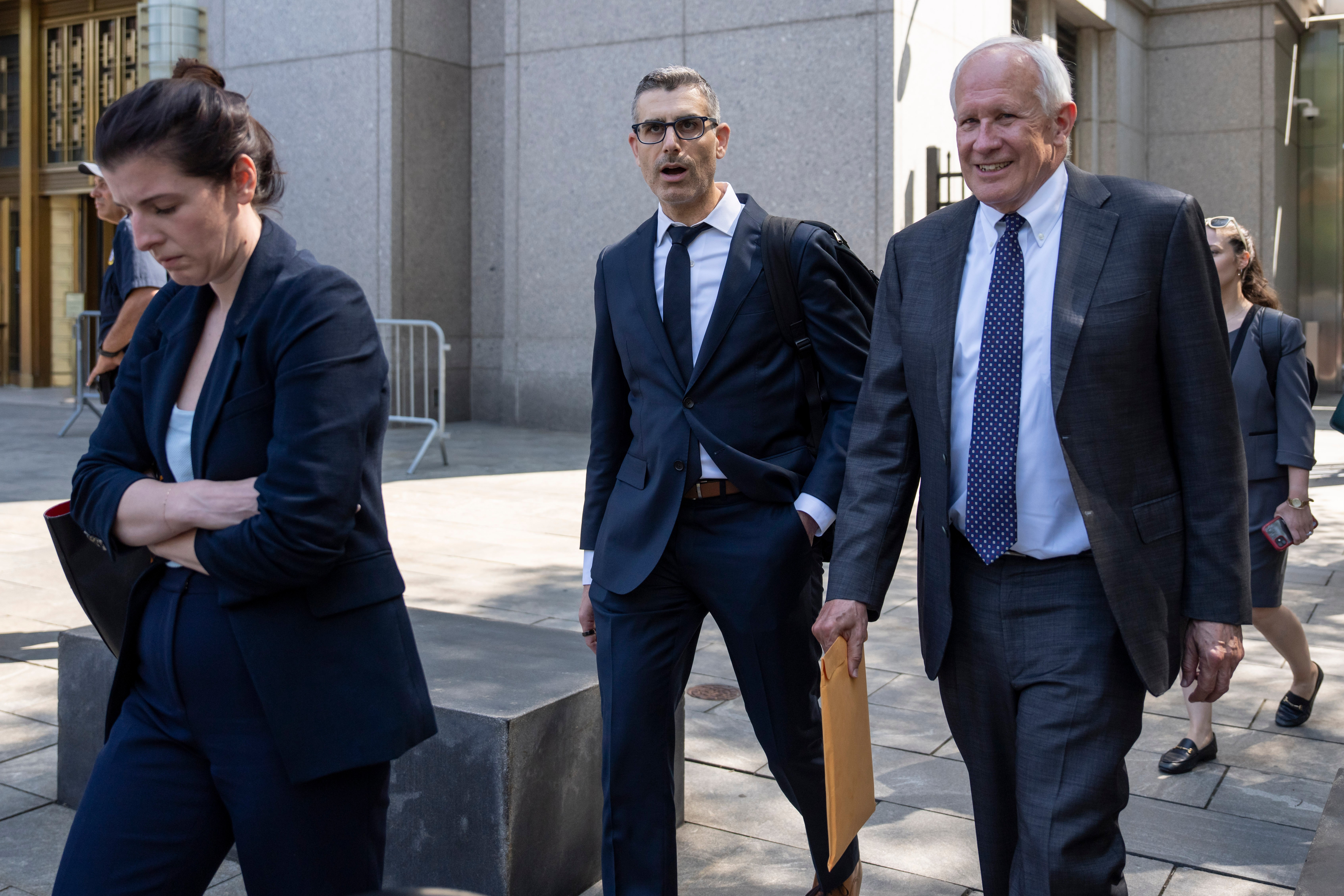 David McCraw, right, general counsel for the New York Times, and Douglas Zolkind, center, attorney for the New York Times, leave Manhattan federal court, Thursday, July 23, 2026, in New York. (AP Photo/Yuki Iwamura)