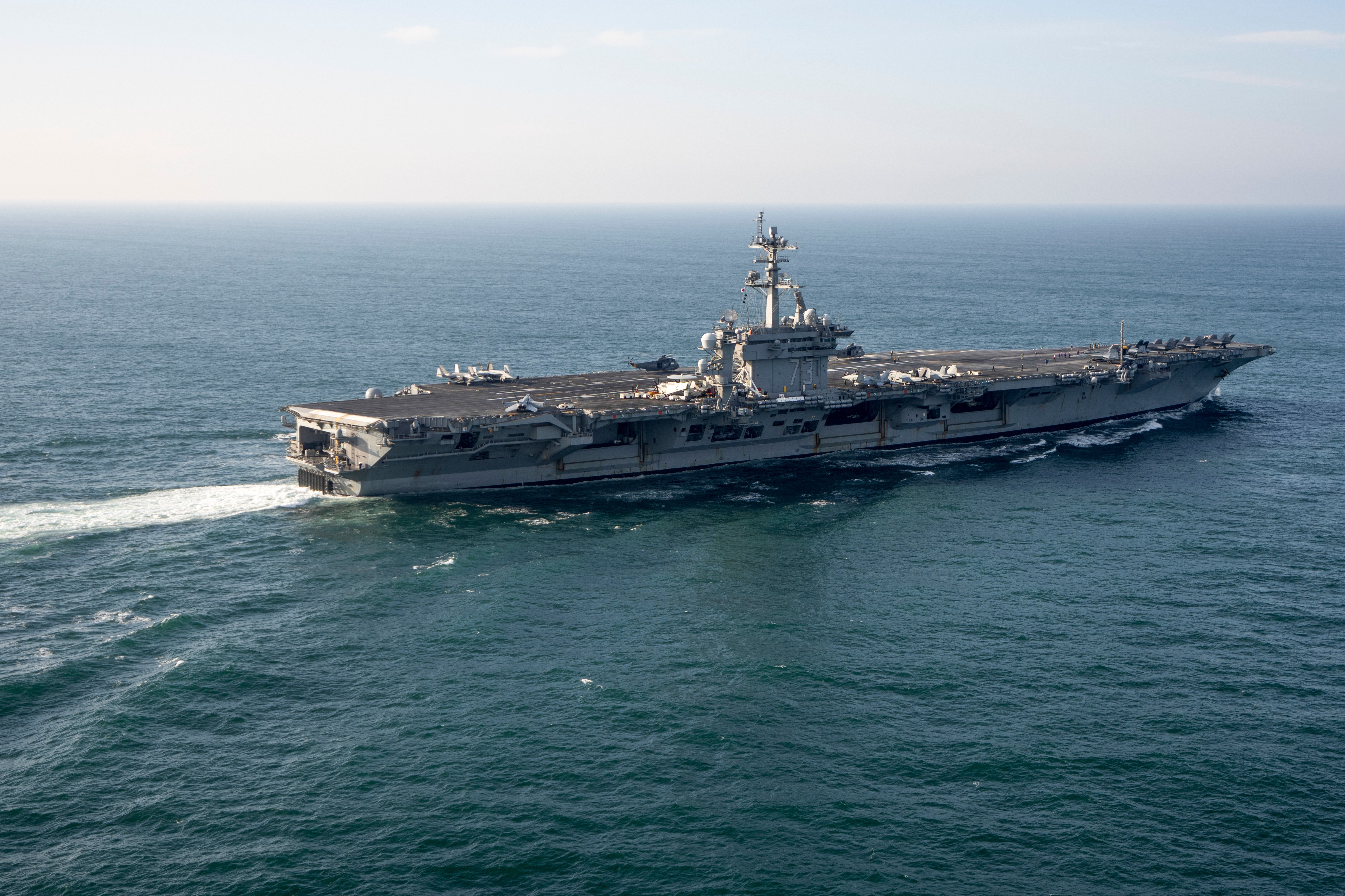 An aircraft carrier is pictured in the sea.