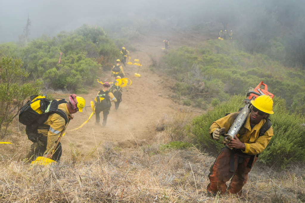 firefighters cut a fire break