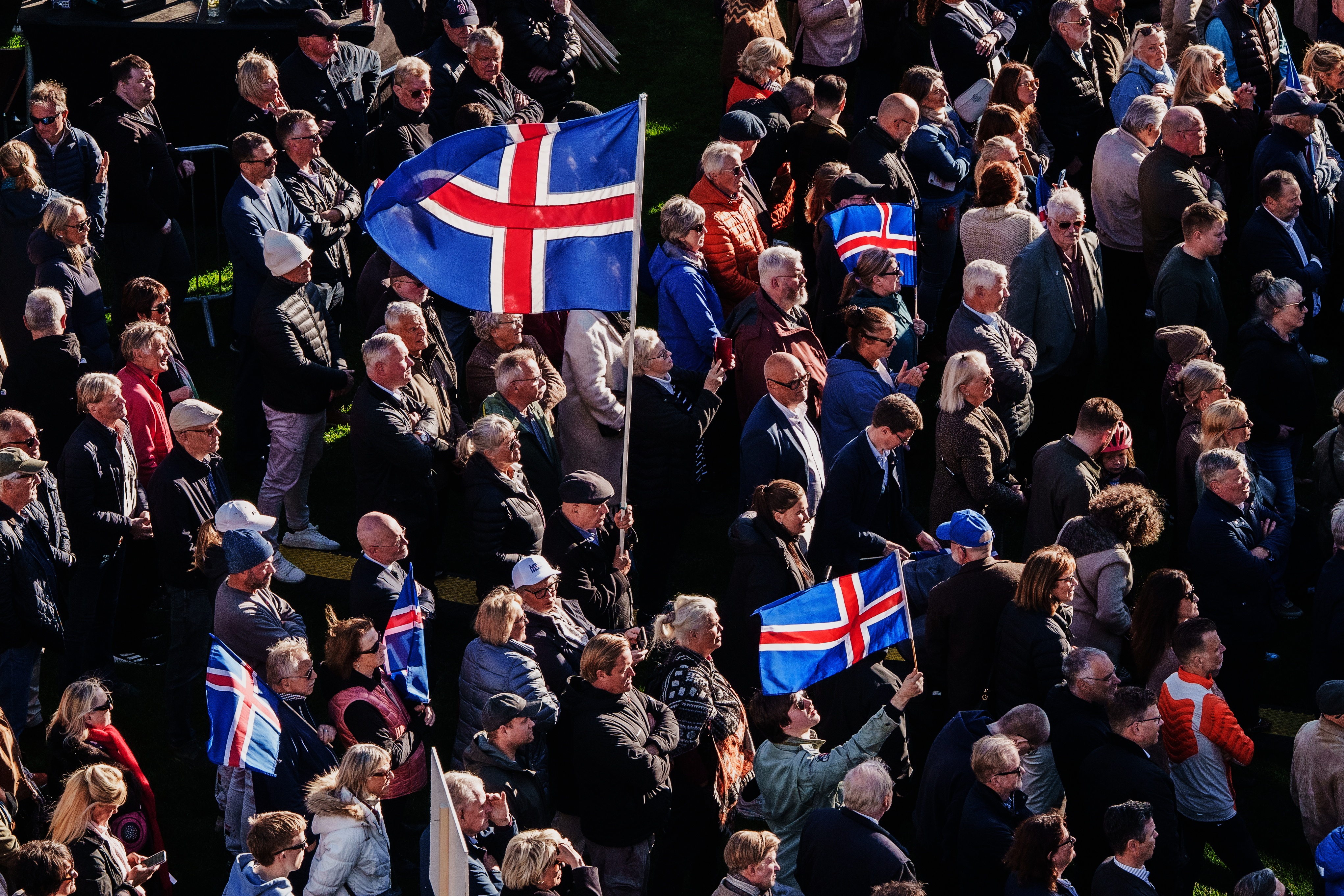 People with Icelandic flags attend an "Afram Island", "Forward, Iceland", rally, opposing the resumption of European Union accession talks