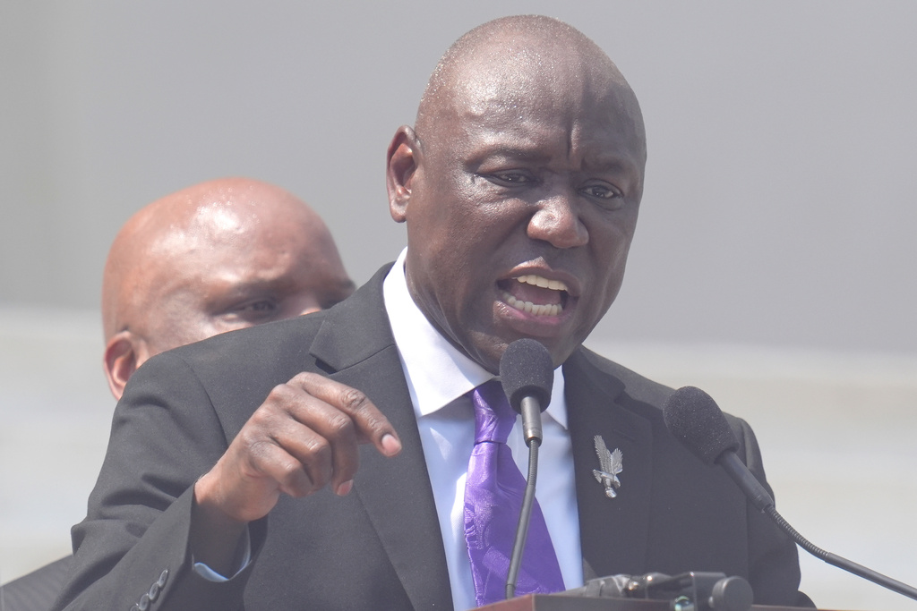 A civil rights attorney speaks at a protest