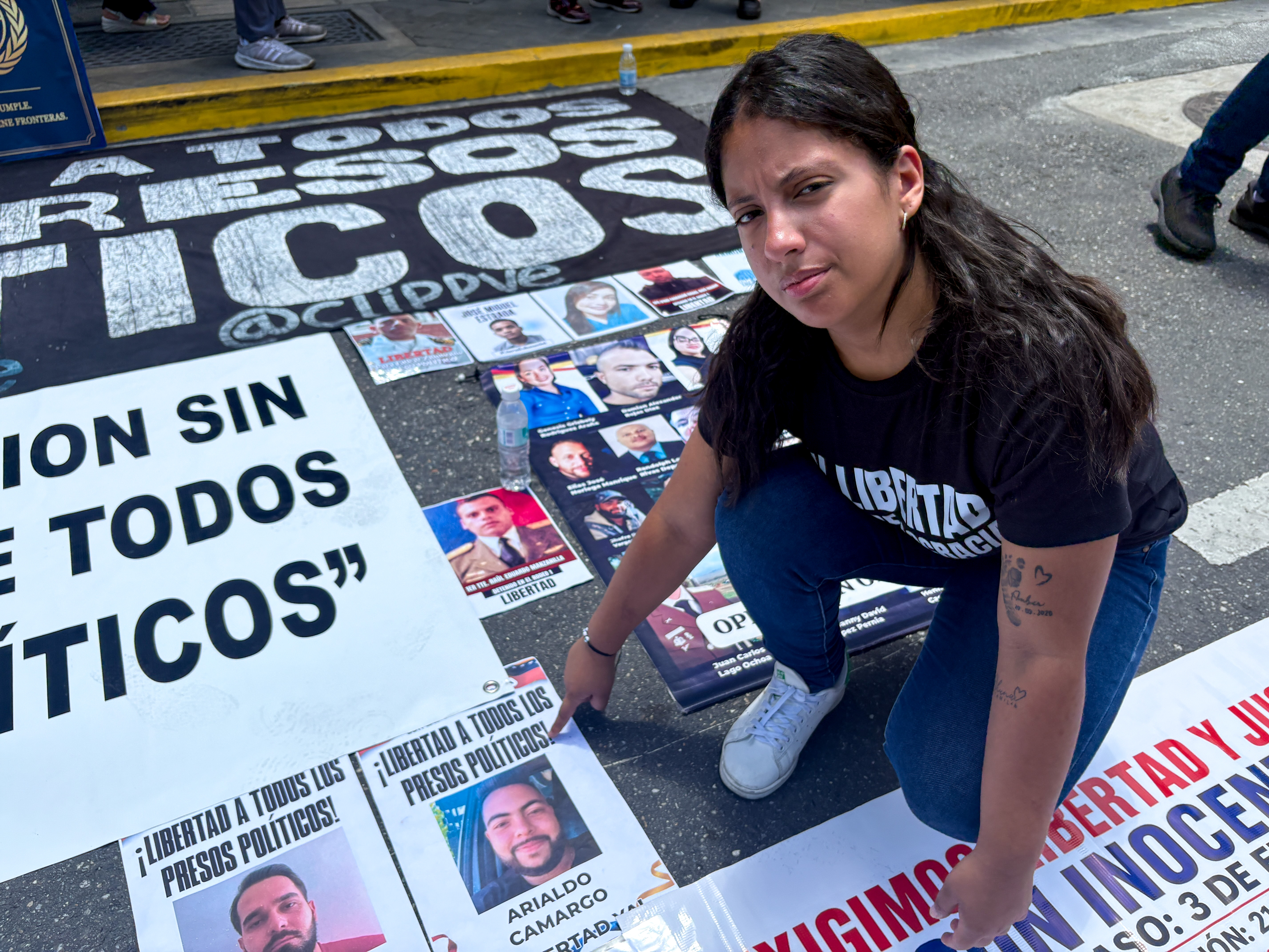 Aranza Hernandez attends a protest in Caracas that called on the negotiations to take into account Venezuela's political prisoners
