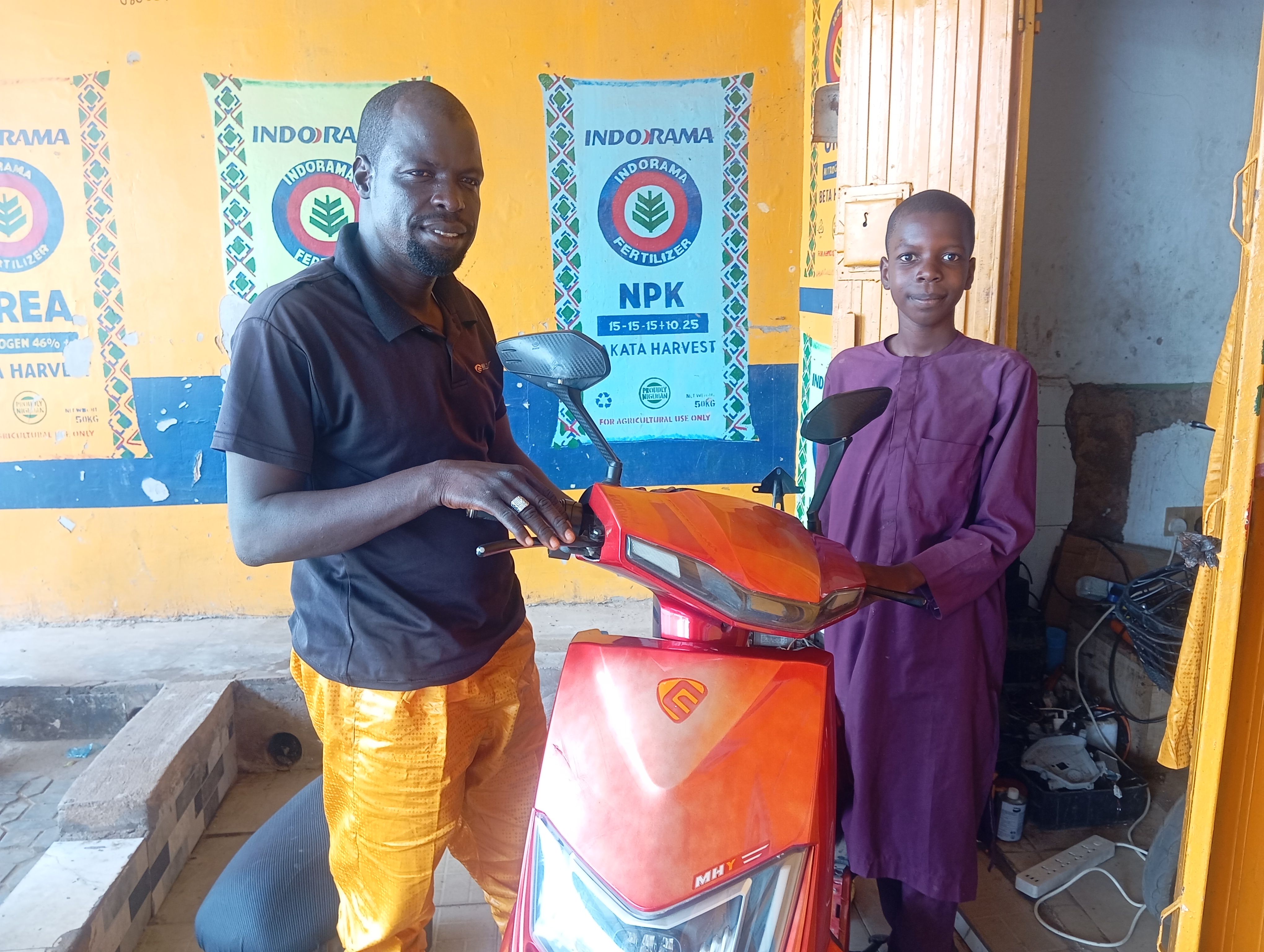 Hussaini Isa repairs electric motorcycles in Gombe, where demand for e-bikes is gradually growing amid rising petrol prices. [Muhammad Auwal Ibrahim/Al Jazeera]