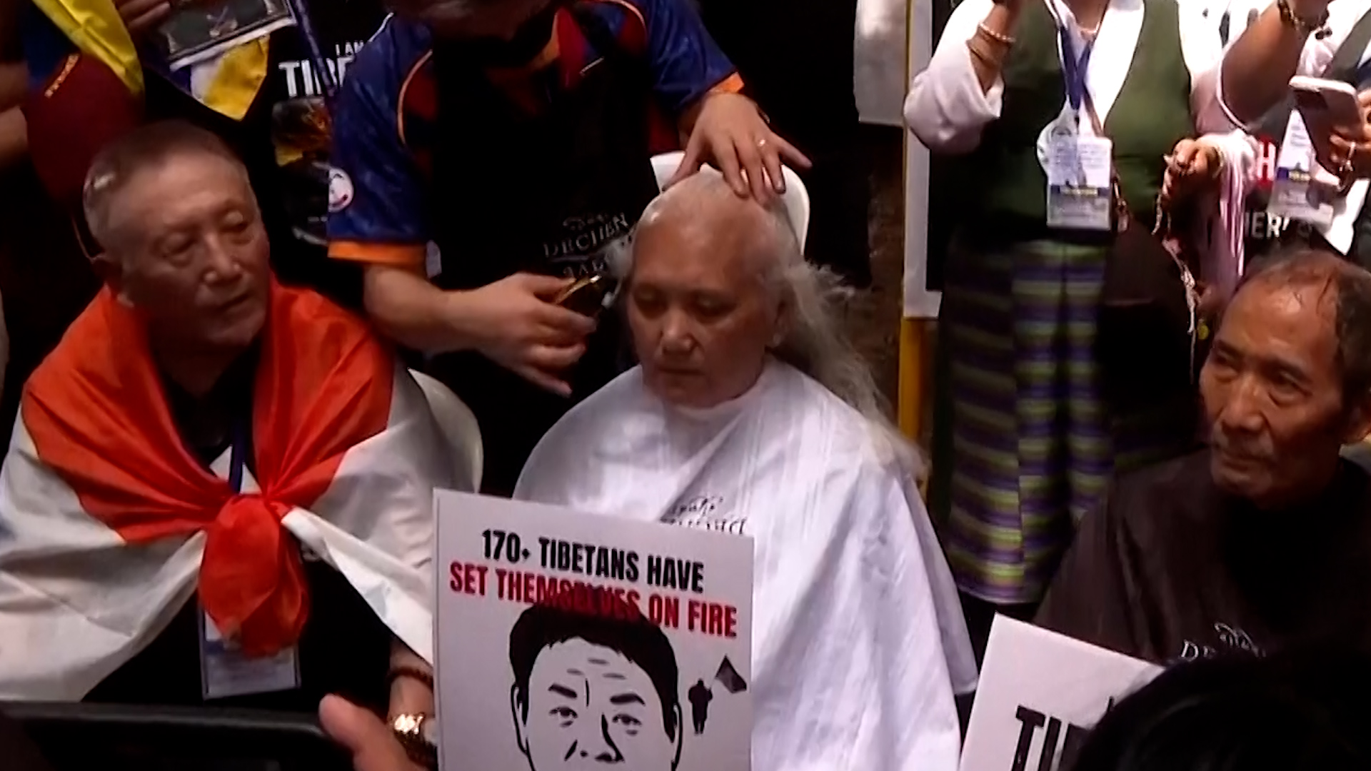 Tibetan protesters shave heads against China's Unity Law.
