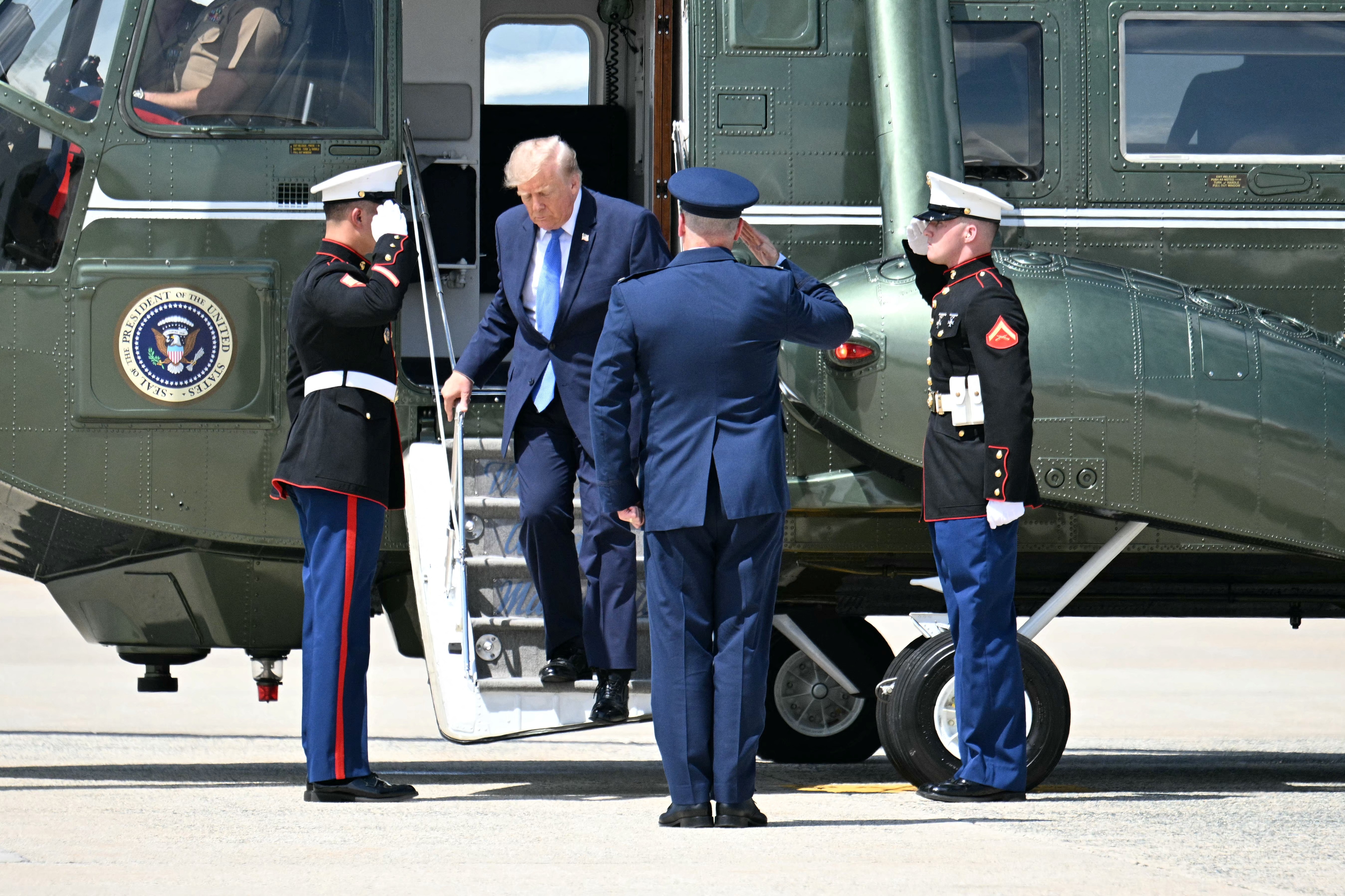 US President Donald Trump steps off Marine One to board Air Force One at Joint Base Andrews, Maryland, on August 4, 2026 [AFP]
