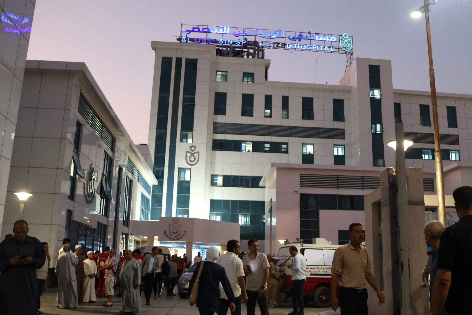 Relatives and friends wait outside the Al-Qassasin Specialized Hospital for news following a road accident in which some 18 people were killed, in the town of al-Qassasin, in the Ismailia Governorate, about 120 km east of Cairo on August 11, 2026.