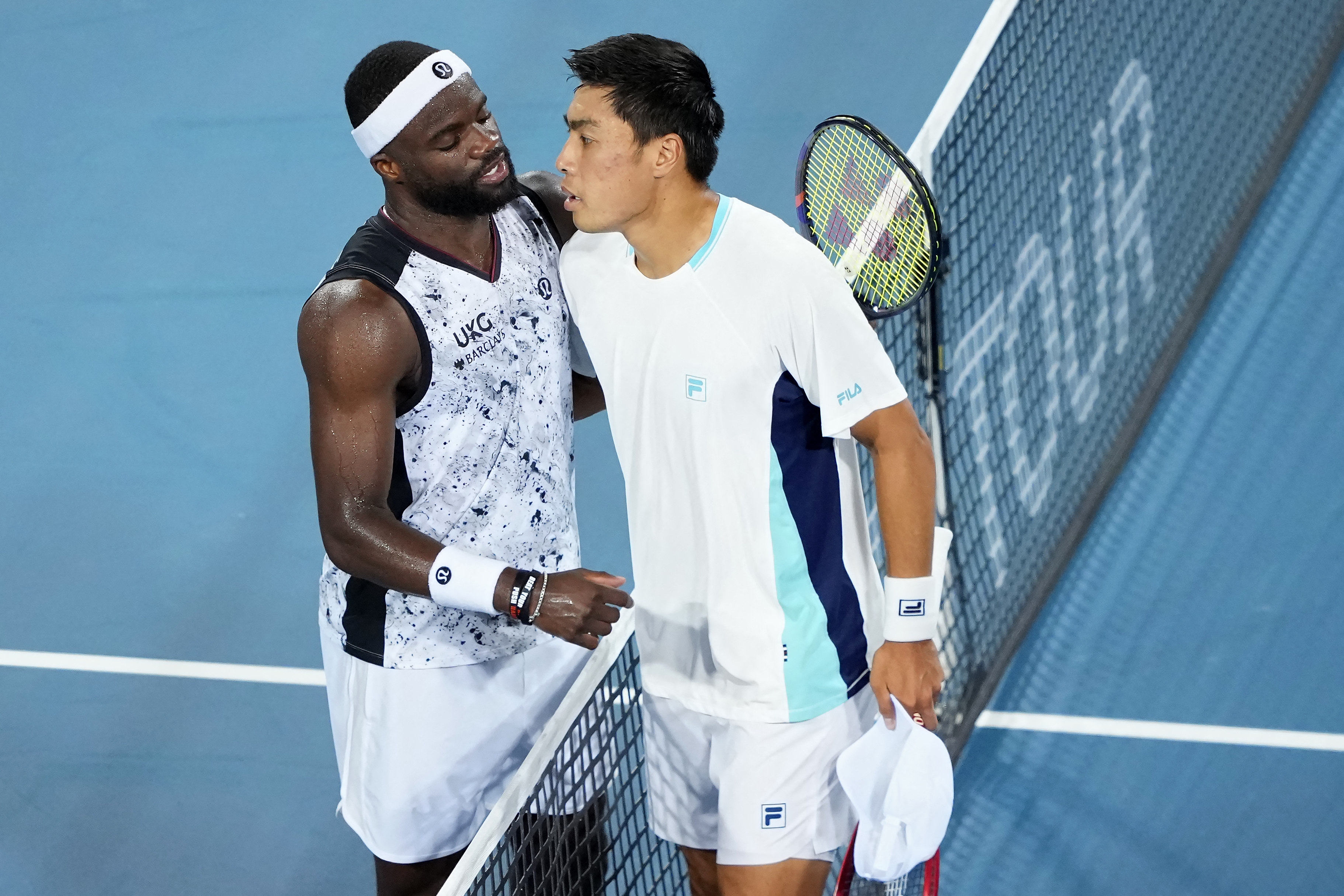 MASON, OHIO - AUGUST 22: Frances Tiafoe of the United States (L) and Brandon Nakashima of the United States meet at the net after Tiafoe won their match during day 12 of the Cincinnati Open at the Lindner Family Tennis Center on August 22, 2026 in Mason, Ohio. Dylan Buell/Getty Images/AFP (Photo by Dylan Buell / GETTY IMAGES NORTH AMERICA / Getty Images via AFP)