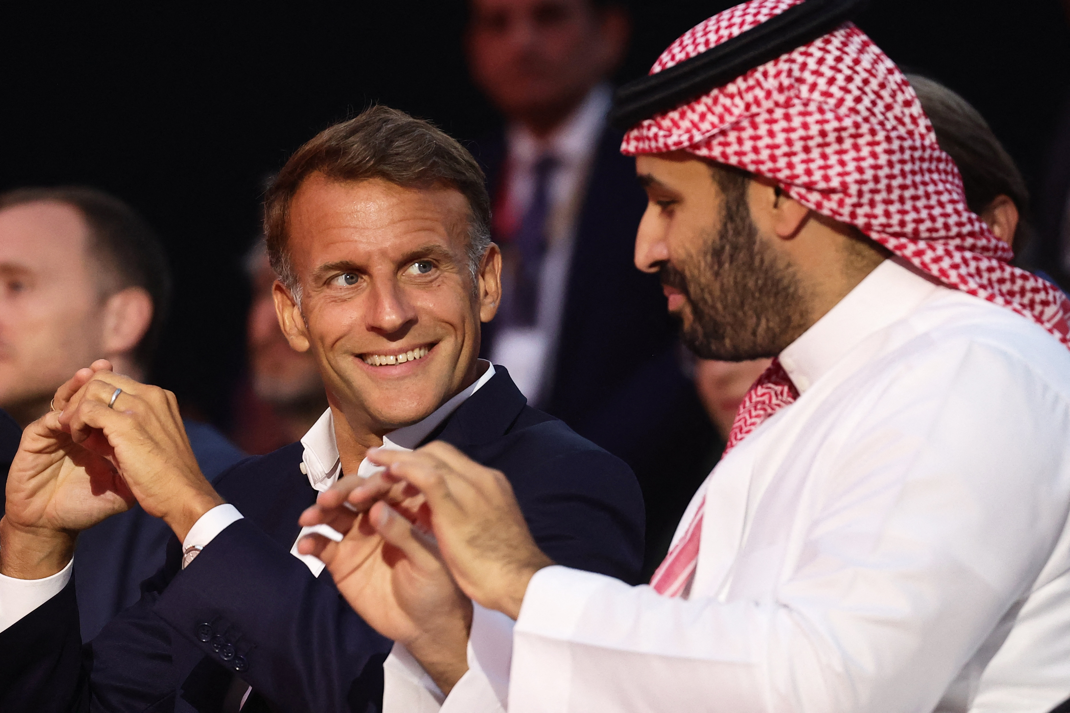TOPSHOT - French President Emmanuel Macron (L) and the Crown Prince and Prime Minister of Saudi Arabia Mohammed bin Salman attend the closing ceremony of the Esports World Cup at the Grand Palais in Paris, France, on August 23, 2026. (Photo by Teresa SUAREZ / POOL / AFP)
