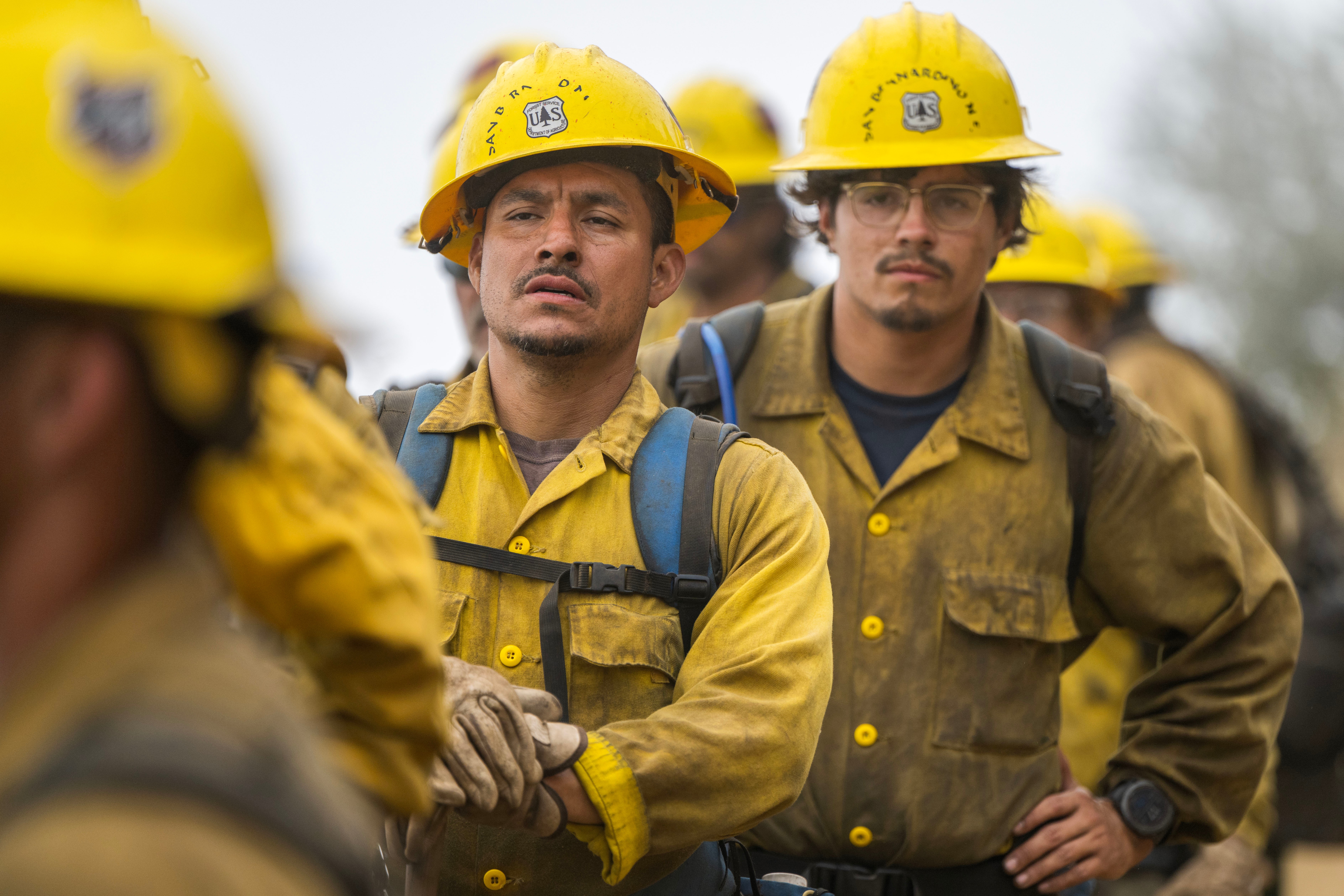 A fire crew stands on Coast Ridge Road as the Timber Fire burns in Big Sur, Calif., Thursday, Aug. 13, 2026. (AP Photo/Nic Coury)
