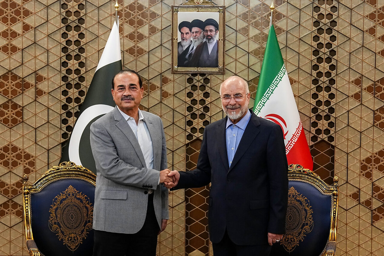 Iran's Parliament Speaker Mohammad Bagher Qalibaf, right, shakes hands with Pakistan's Army Chief Field Marshal Gen. Asim Munir during their meeting in Tehran, Iran, Sunday, May 23, 2026. (Hamed Malekpour/ICANA via AP)