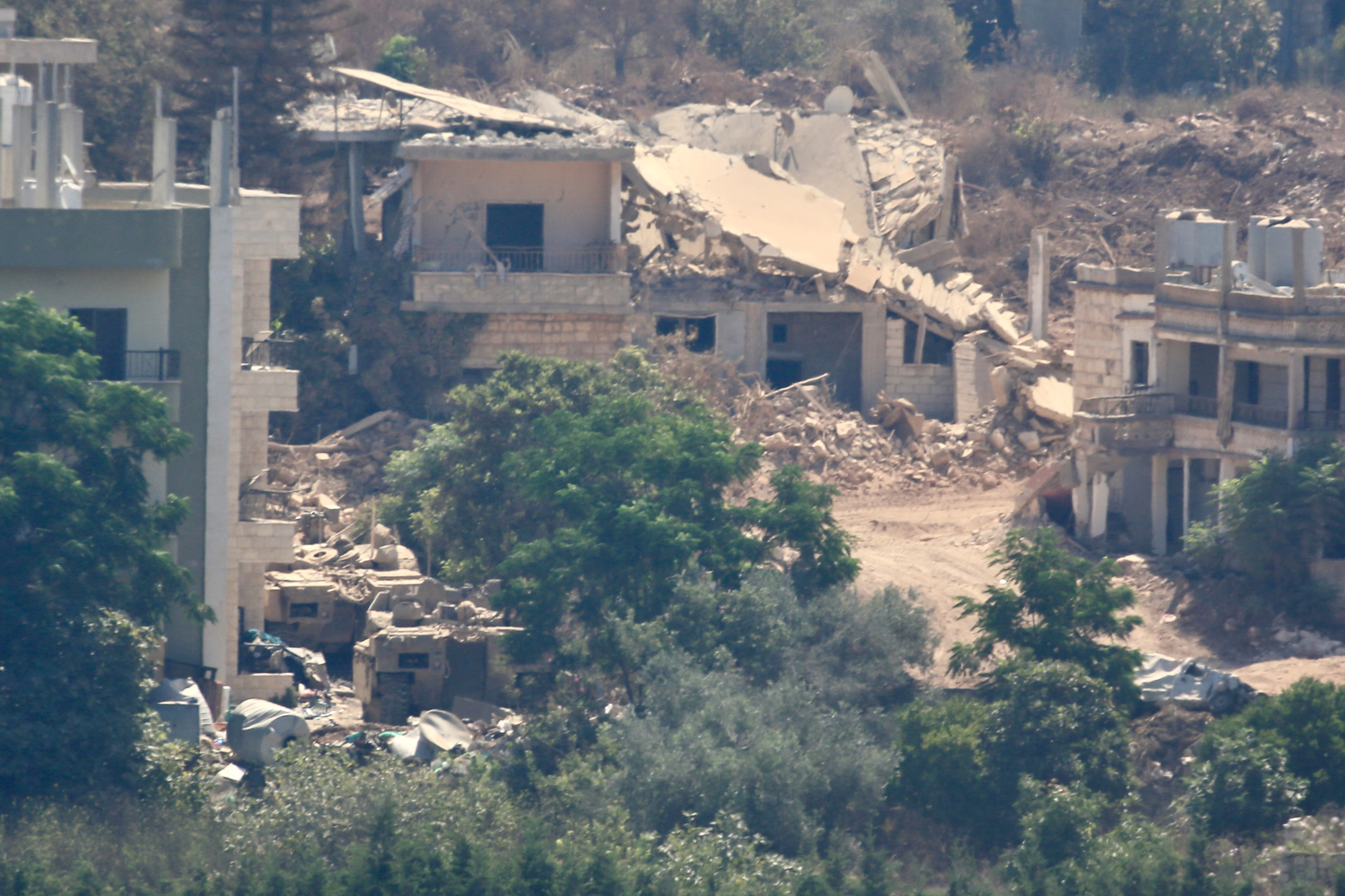 Buildings hit by Israeli strikes lie in ruins in Zawtar al-Sharqiyah, Lebanon as seen from Zawtar al-Gharbiya, one of the designated pilot zones under the ceasefire agreement between Lebanon and Israel, from which Israeli forces have withdrawn, August 5, 2026