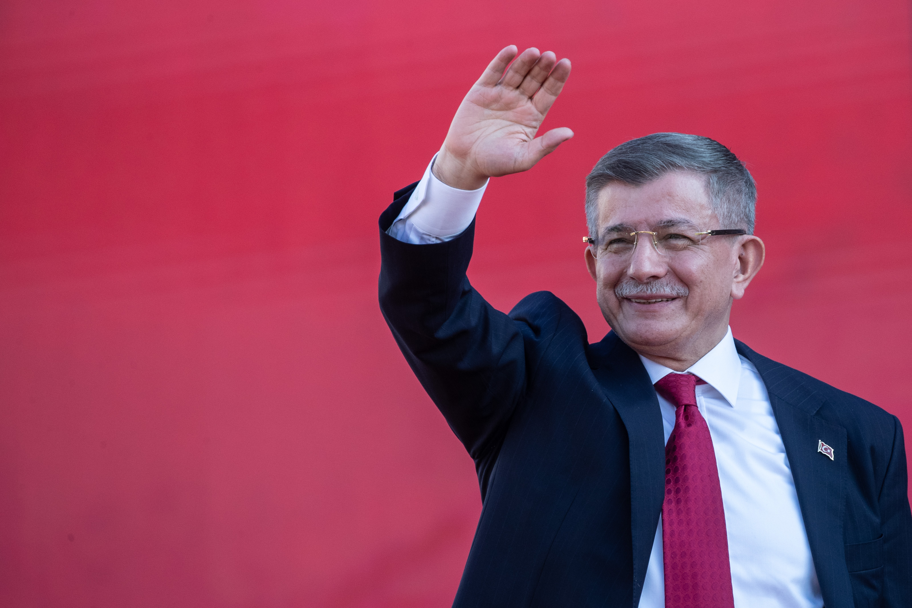 IZMIR, TURKEY - APRIL 30: Former Prime Miniser and Ahmet Davutoglu, and the vice presidential candidate of the Main Opposition alliance, greets to supporters at a rally while campaigning for the presidential election on April 30, 2023 in Izmir, Turkey. CHP leader Kemal Kilicdaroglu is holding campaign rallies across Turkey ahead of the countries May 14, 2023 presidential and parliamentary elections. The Kilicdaroglu-led Nation Alliance is representing six opposition parties in next month's election against President Recep Tayyip Erdogan's 20-year rule. (Photo by Burak Kara/Getty Images)
