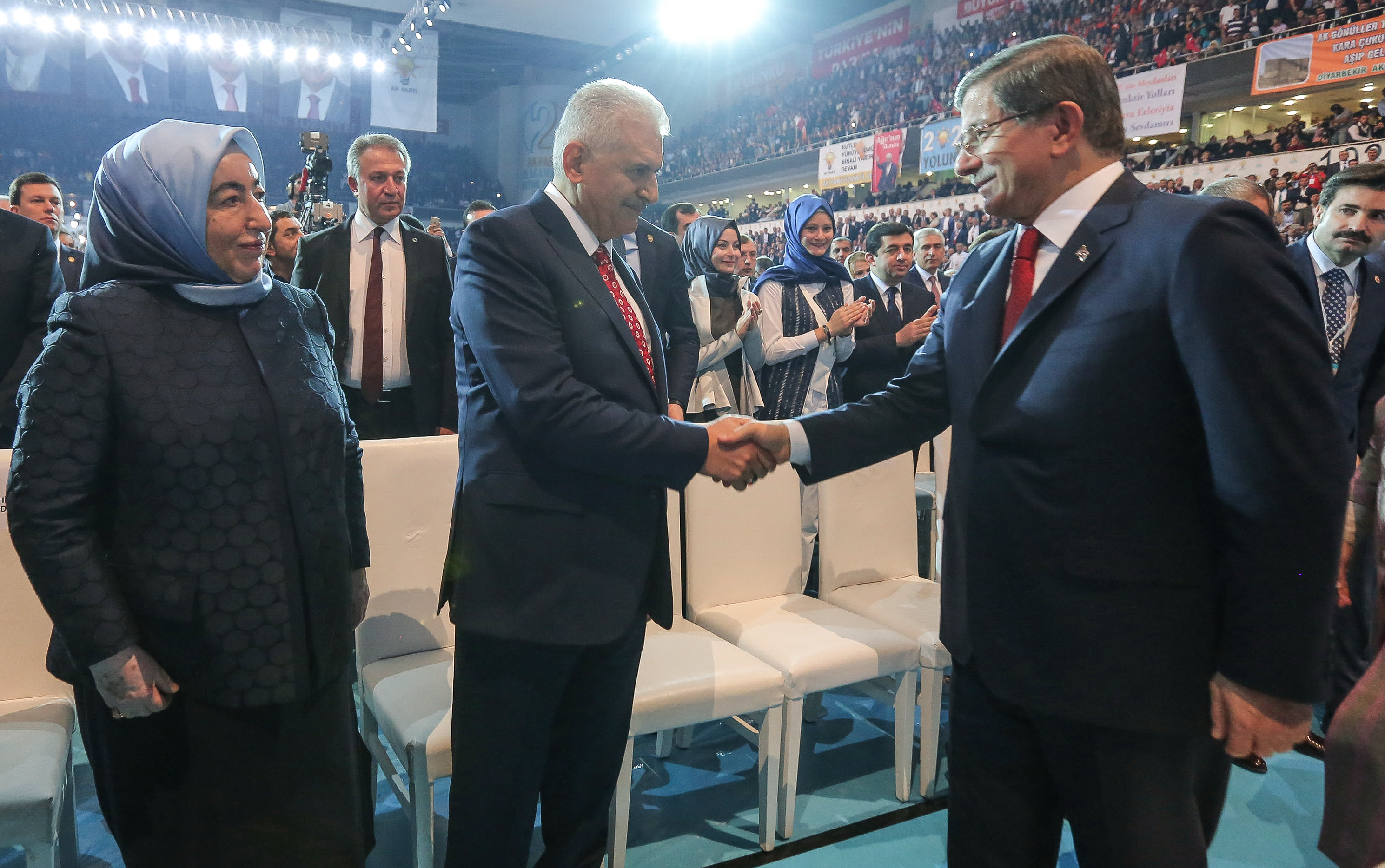 ANKARA, TURKEY - MAY 22: Turkey's PM Ahmet Davutoglu (R) greets Transport and Comunication Minister Binali Yildirim and his wife Semiha Yildirim (L) during the Extraordinary Congress of the ruling AK Party (AKP) to choose the new leader of the party on May 22, 2016 in Ankara, Turkey. Turkey's Transport and Communication Minister Binali Yildirim is the sole candidate to head AK Party and as the new Prime Minister of Turkey. (Photo by Gokhan Tan/Getty Images)