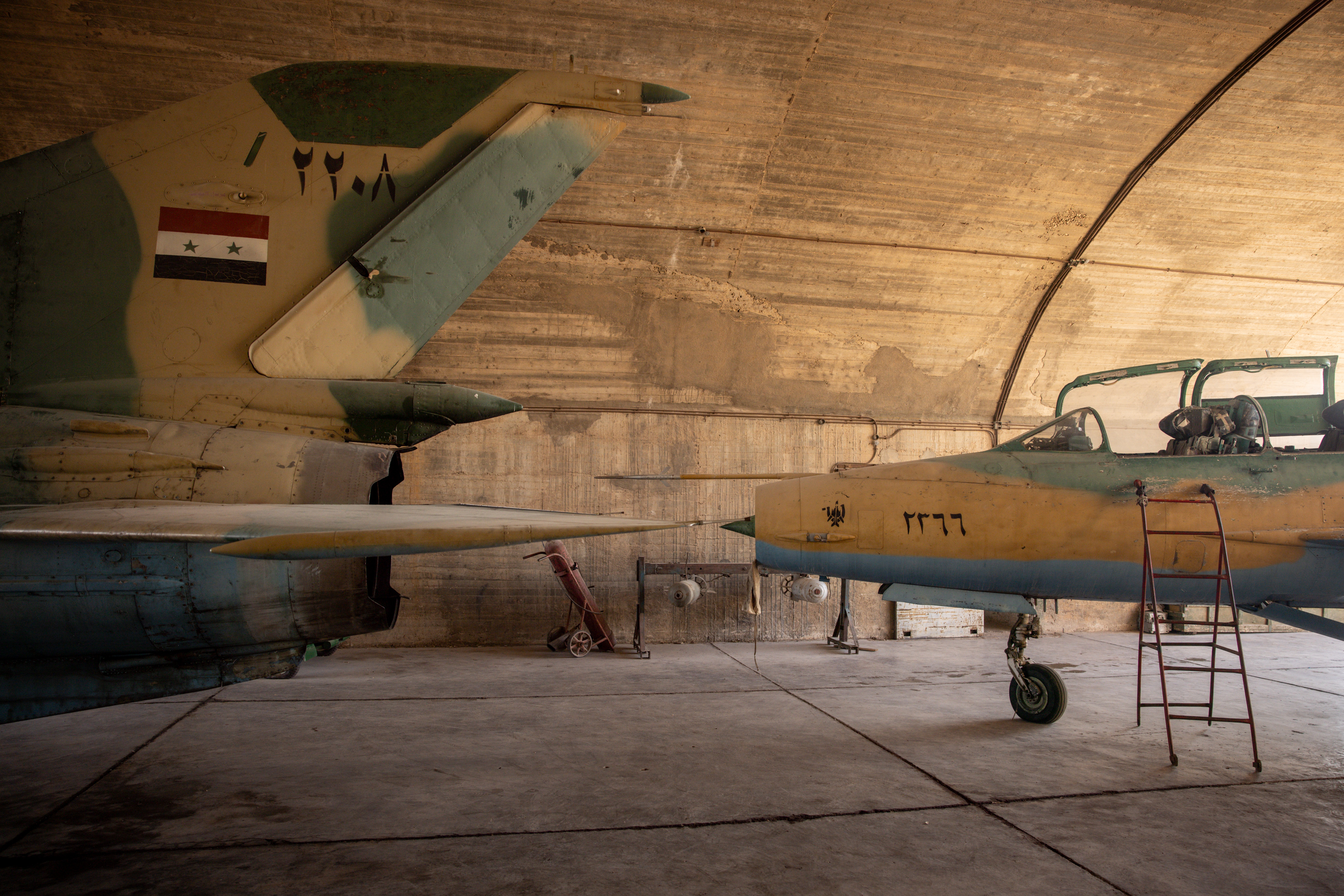 HAMA, SYRIA - DECEMBER 18: Syrian Army fighter jets are seen at the Hama Air Force base on December 18, 2024 in Hama, Syria. Mount Zayn al-Abidin was the site of pivotal clashes between Syrian government forces and rebels during the rebels' lightning offensive toward Damascus earlier this month. Hama, which lies around 200 kilometers (125 miles) north of the capital, saw some of the biggest protests against the Assad regime during the Arab uprising in 2011. (Photo by Chris McGrath/Getty Images)