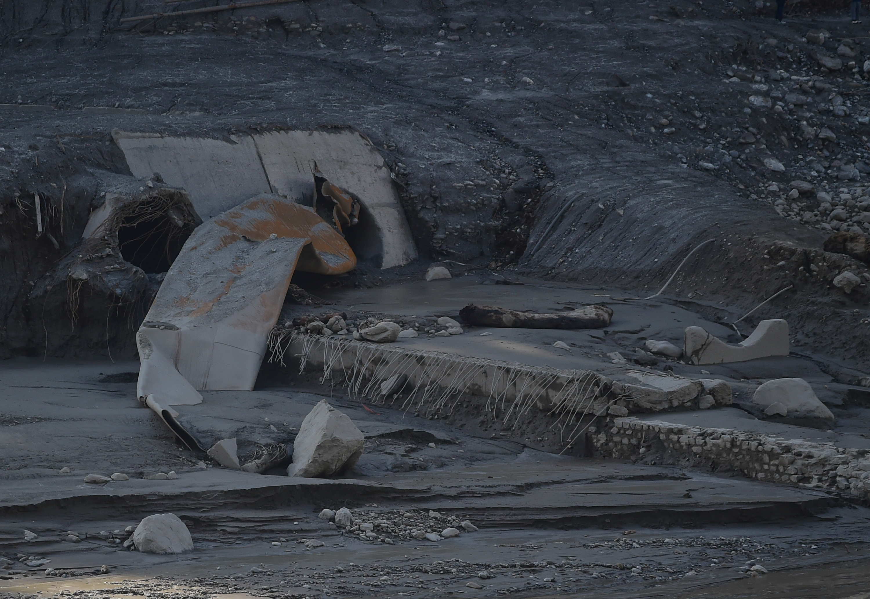 TRISHULI, NEPAL - AUGUST 30: A view of damaged tunnel of the Trishuli Hydropower Plant on the banks of the swollen Trishuli River following landslides on August 30, 2026, in Trishuli, Nepal. Authorities said the August 26 flash floods were triggered after a mass of ice, mud and rock collapsed into a Himalayan river near the Nepal-China border, leaving hundreds dead and thousands missing, while causing widespread damage in affected districts. Authorities continued the gruelling search for victims, many buried under metres of mud, as both China and Nepal issued fresh flooding alerts. (Photo by Ritesh Shukla/Getty Images)