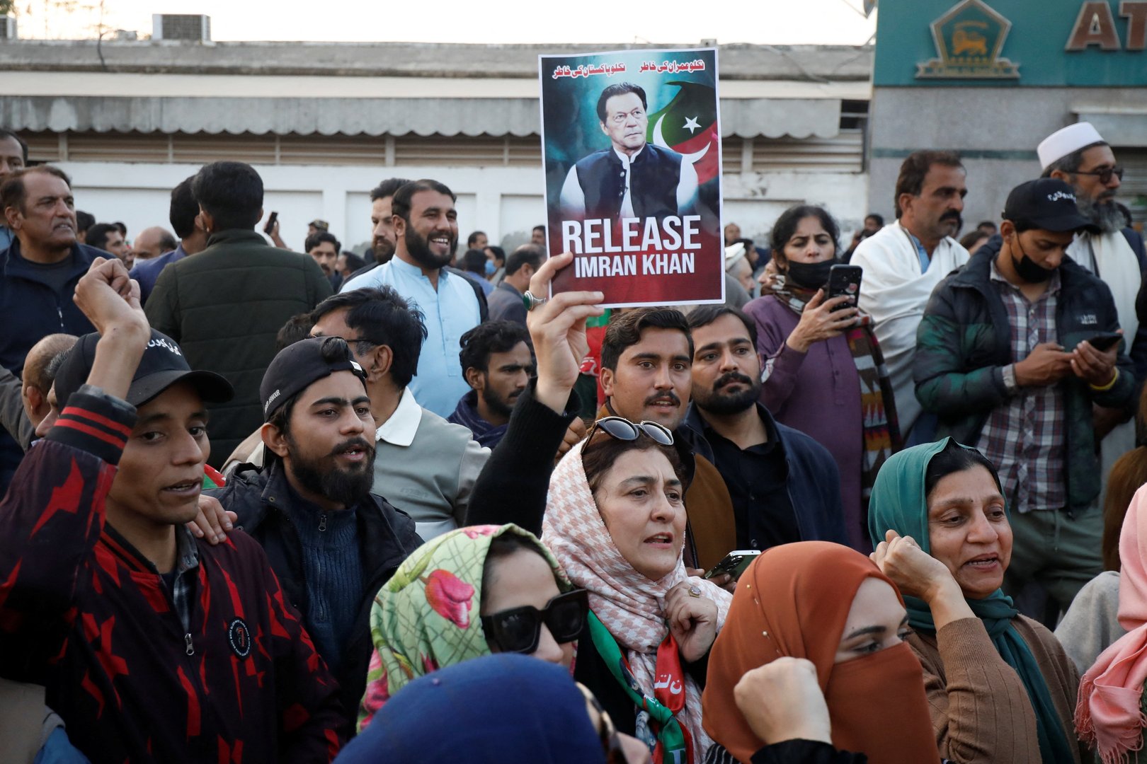 Supporters of jailed former Prime Minister of Pakistan and leader of Pakistan Tehreek-e-Insaf (PTI) party Imran Khan, gather during a protest over concerns about their leader's health, on a road leading to Adiala jail in Rawalpindi, Pakistan, December 2, 2025. [REUTERS/Salahuddin]
