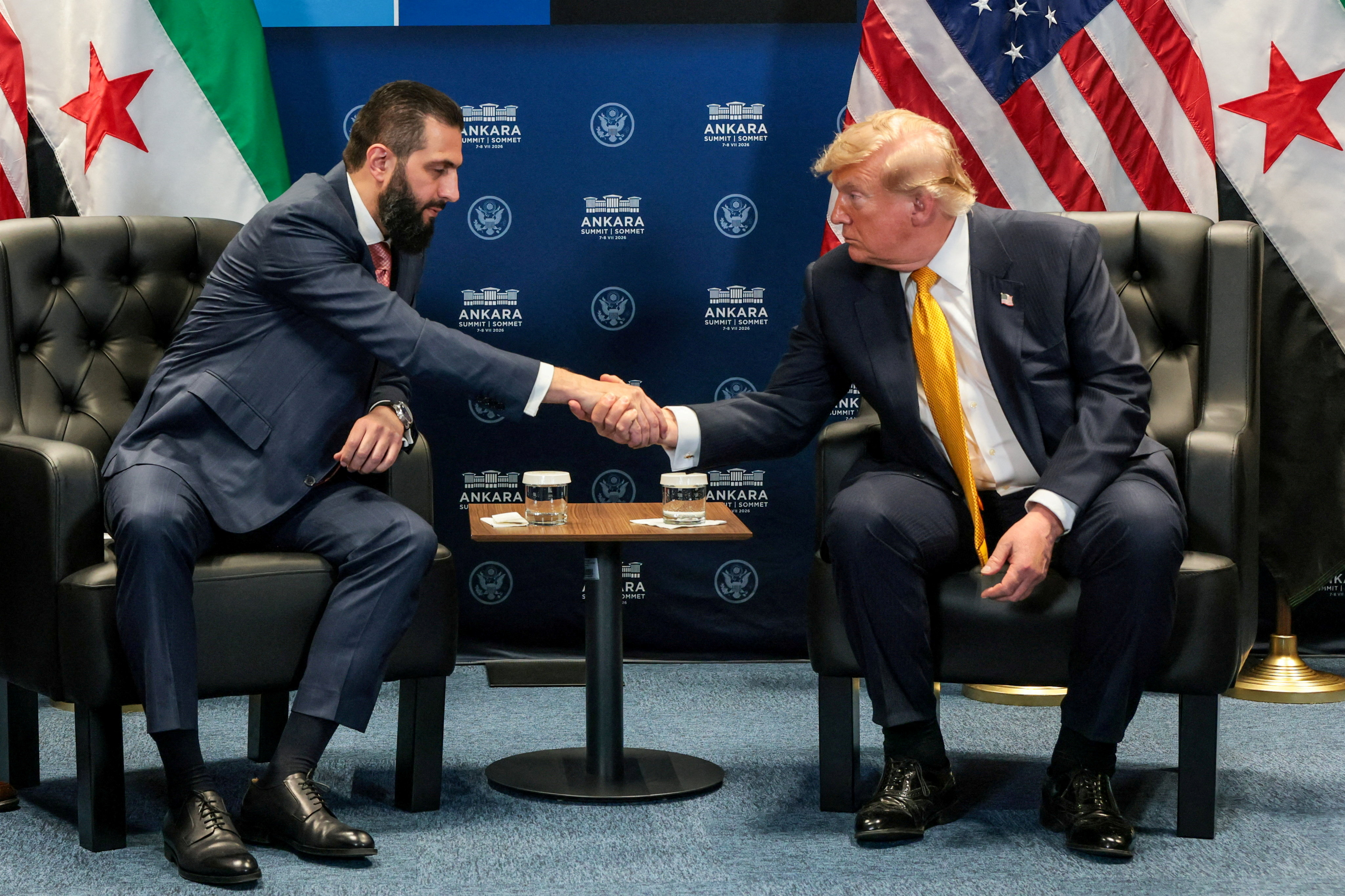 FILE PHOTO: U.S. President Donald Trump shakes hands with Syrian President Ahmed al-Sharaa during a bilateral meeting alongside the NATO leaders summit at the Bestepe Presidential Compound in Ankara, Turkey, July 8, 2026. REUTERS/Jonathan Ernst/File Photo
