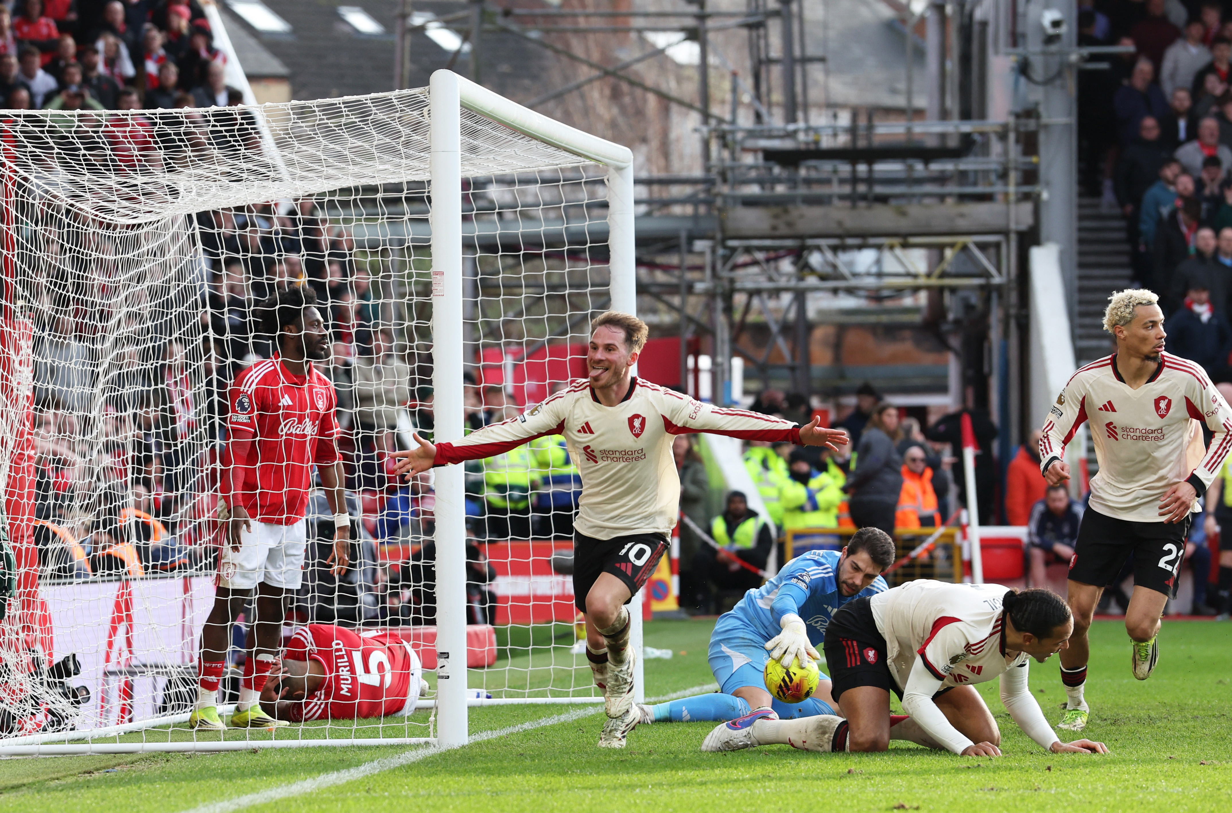 Soccer Football - Premier League - Nottingham Forest v Liverpool - The City Ground, Nottingham, Britain - February 22, 2026 Liverpool's Alexis Mac Allister celebrates scoring their first goal REUTERS/Chris Radburn EDITORIAL USE ONLY. NO USE WITH UNAUTHORIZED AUDIO, VIDEO, DATA, FIXTURE LISTS, CLUB/LEAGUE LOGOS OR 'LIVE' SERVICES. ONLINE IN-MATCH USE LIMITED TO 120 IMAGES, NO VIDEO EMULATION. NO USE IN BETTING, GAMES OR SINGLE CLUB/LEAGUE/PLAYER PUBLICATIONS. PLEASE CONTACT YOUR ACCOUNT REPRESENTATIVE FOR FURTHER DETAILS..