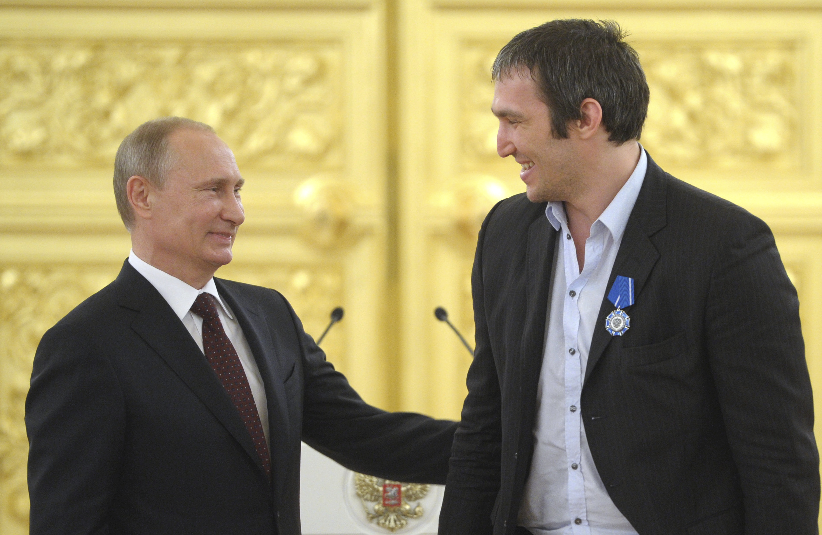 Russia's President Vladimir Putin greets captain Alexander Ovechkin as he meets with players, coaches and officials of team Russia during an award ceremony at the Kremlin in Moscow on May 27, 2014. [File: Alexei Druzhinin/Ria Novosti/Kremlin/Reuters]
