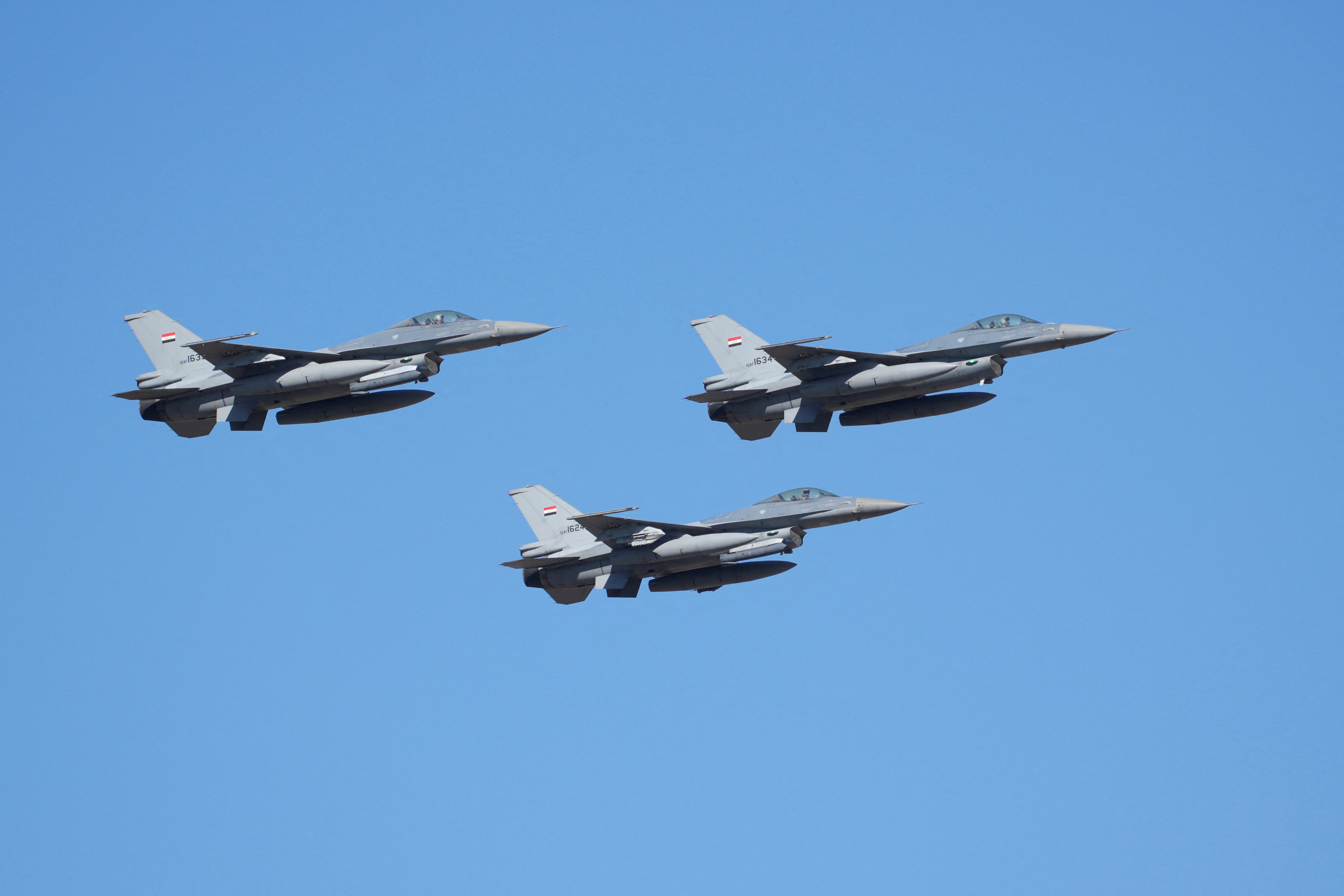 Iraqi fighter jets fly in formation during a parade marking Army Day in Baghdad, Iraq, Saturday, Jan. 6, 2024. The Iraqi Army was activated on Jan. 6, 1921 while under British rule. Hadi Mizban/Pool via REUTERS