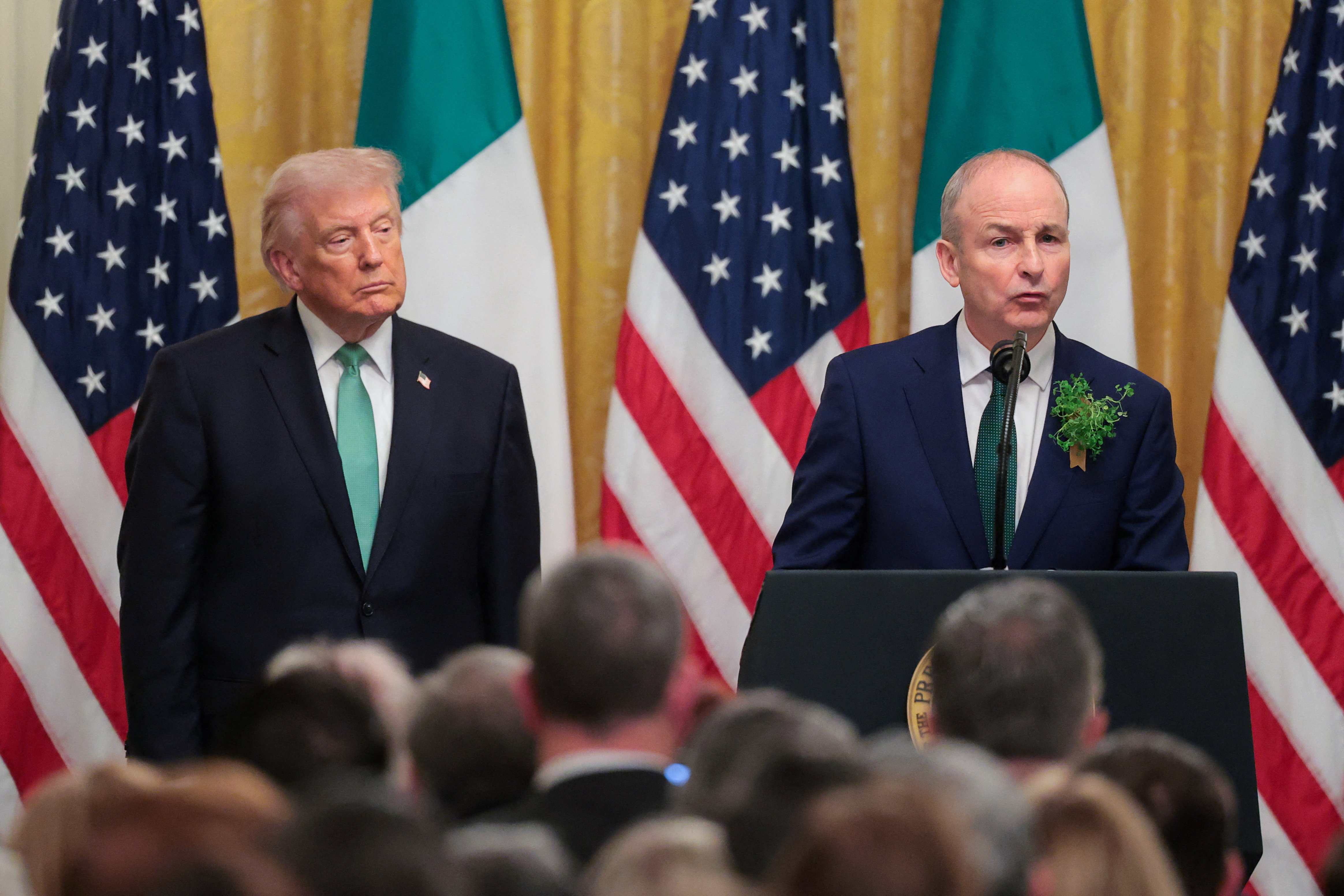 U.S. President Donald Trump and Irish Taoiseach (Prime Minister) Micheal Martin attend a St. Patrick's Day reception in the East Room at the White House in Washington, D.C., U.S. March 17, 2026. REUTERS/Kylie Cooper