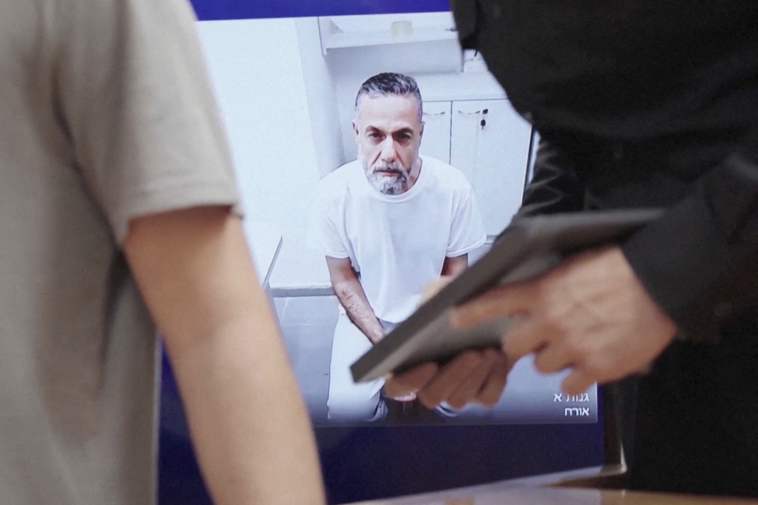 Dr Hussam Abu Safia is seen on a video call from prison during an Israeli Supreme Court hearing of an appeal by his lawyers to end his detention, in Jerusalem, on June 10, 2026