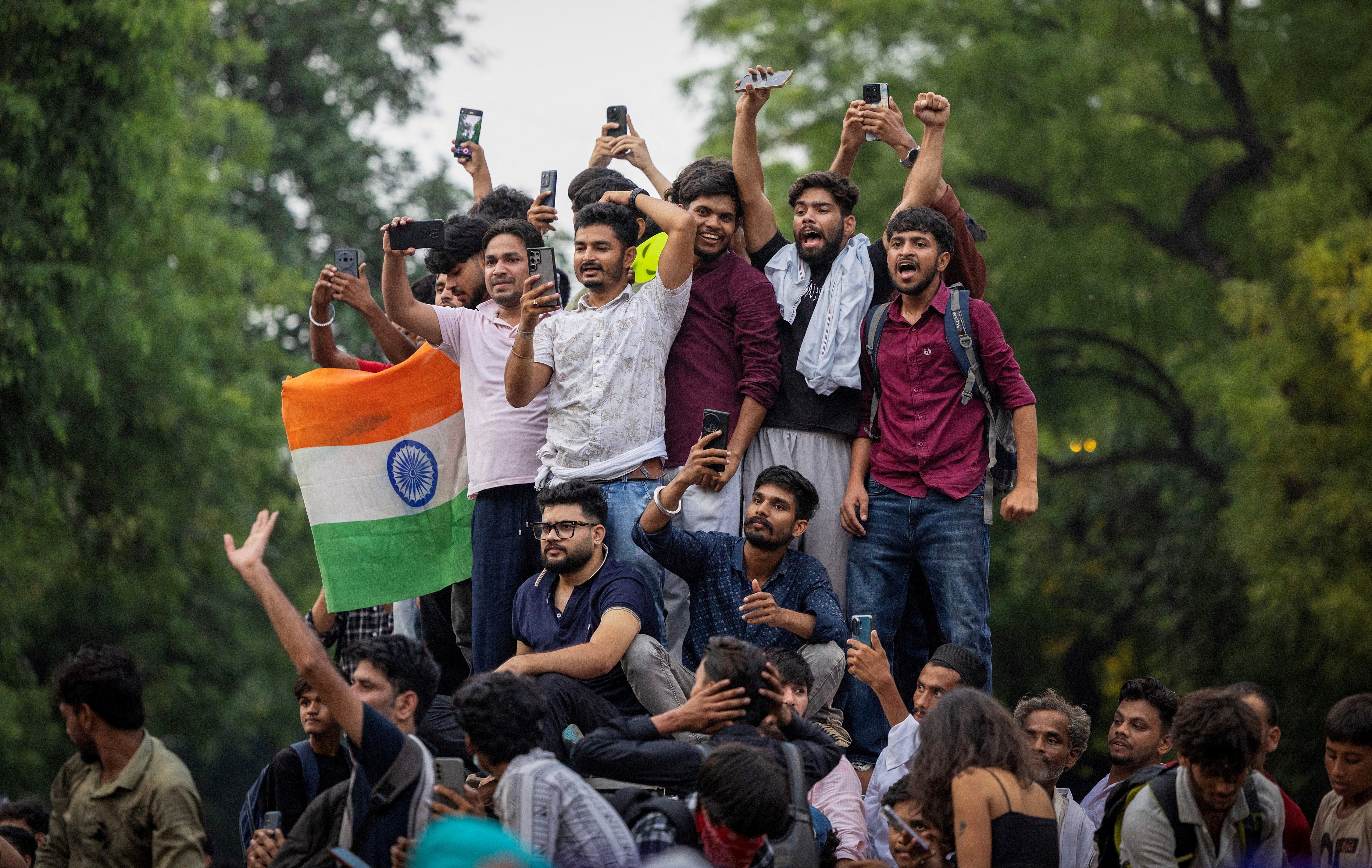 Supporters of India's Cockroach Janta Party (CJP) celebrate after India's Education Minister Dharmendra Pradhan resigned following days of protests demanding his resignation over National Eligibility cum Entrance Test (NEET) examination paper leaks, in New Delhi, India, July 25, 2026. REUTERS/Adnan Abidi TPX IMAGES OF THE DAY