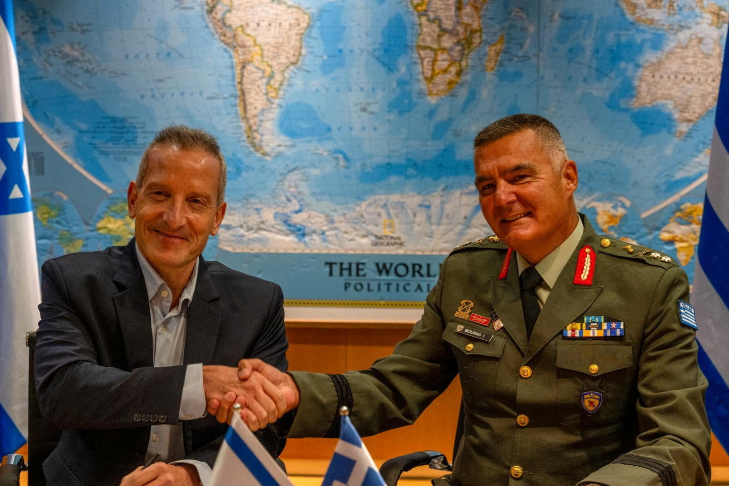 Director General of the Israel Ministry of Defense (IMOD), Maj. Gen. (Res.) Amir Baram, and his Greek counterpart, Ioannis Bouras, shake hands as they signed an approximately €3 billion defense export agreement in a ceremony at the IMOD's headquarters in Tel Aviv in this handout image obtained by Reuters on August 31, 2026. Israel Defence Ministry/Handout via REUTERS THIS IMAGE HAS BEEN SUPPLIED BY A THIRD PARTY. MANDATORY CREDIT. BEST QUALITY AVAILABLE.