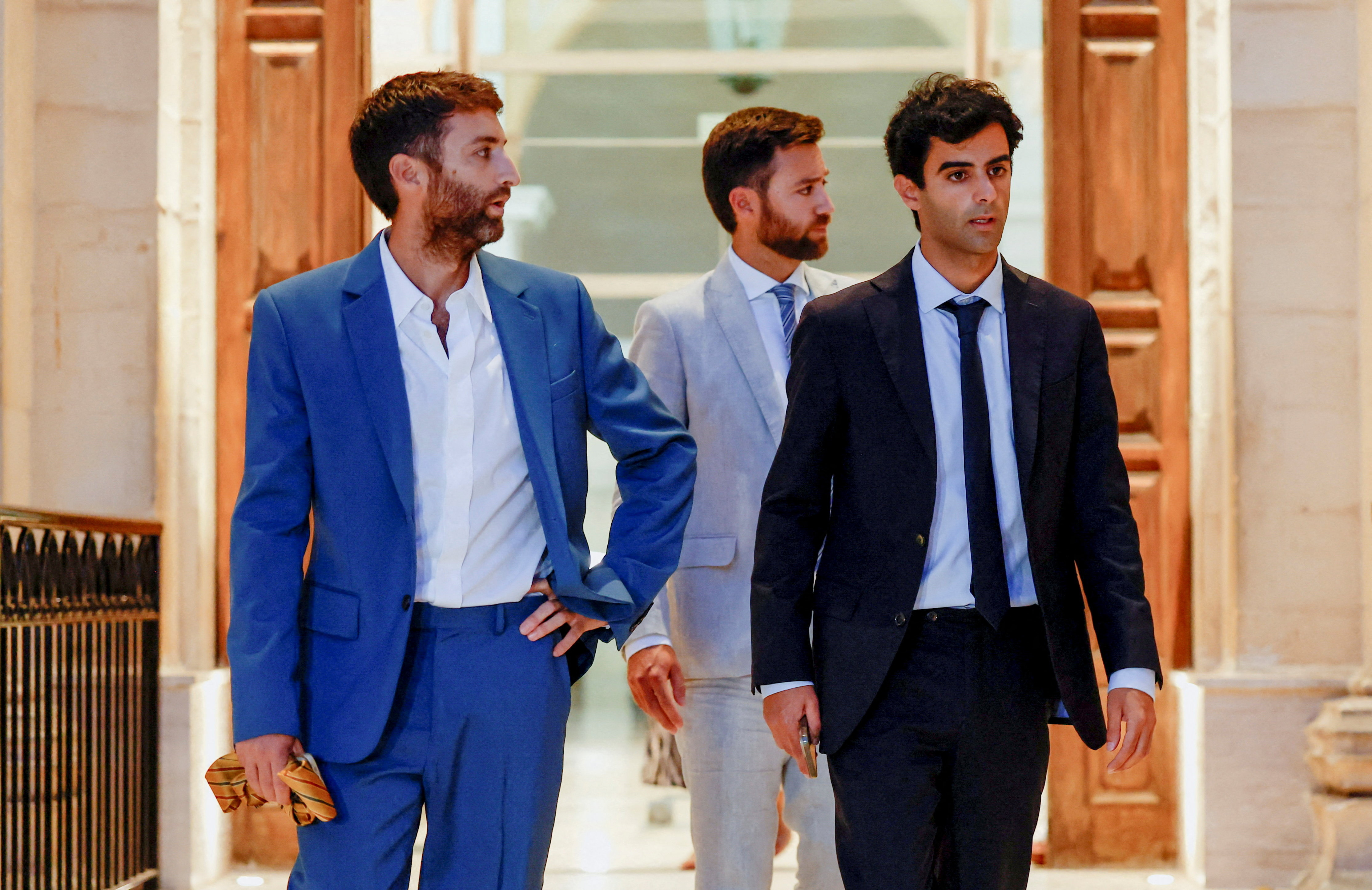 The sons of investigative journalist Daphne Caruana Galizia, Matthew, Andrew and Paul, step out of court after Maltese businessman Yorgen Fenech was acquitted of conspiracy to murder her in 2017, in Valletta, Malta, on September 2, 2026. [Darrin Zammit Lupi/Reuters]