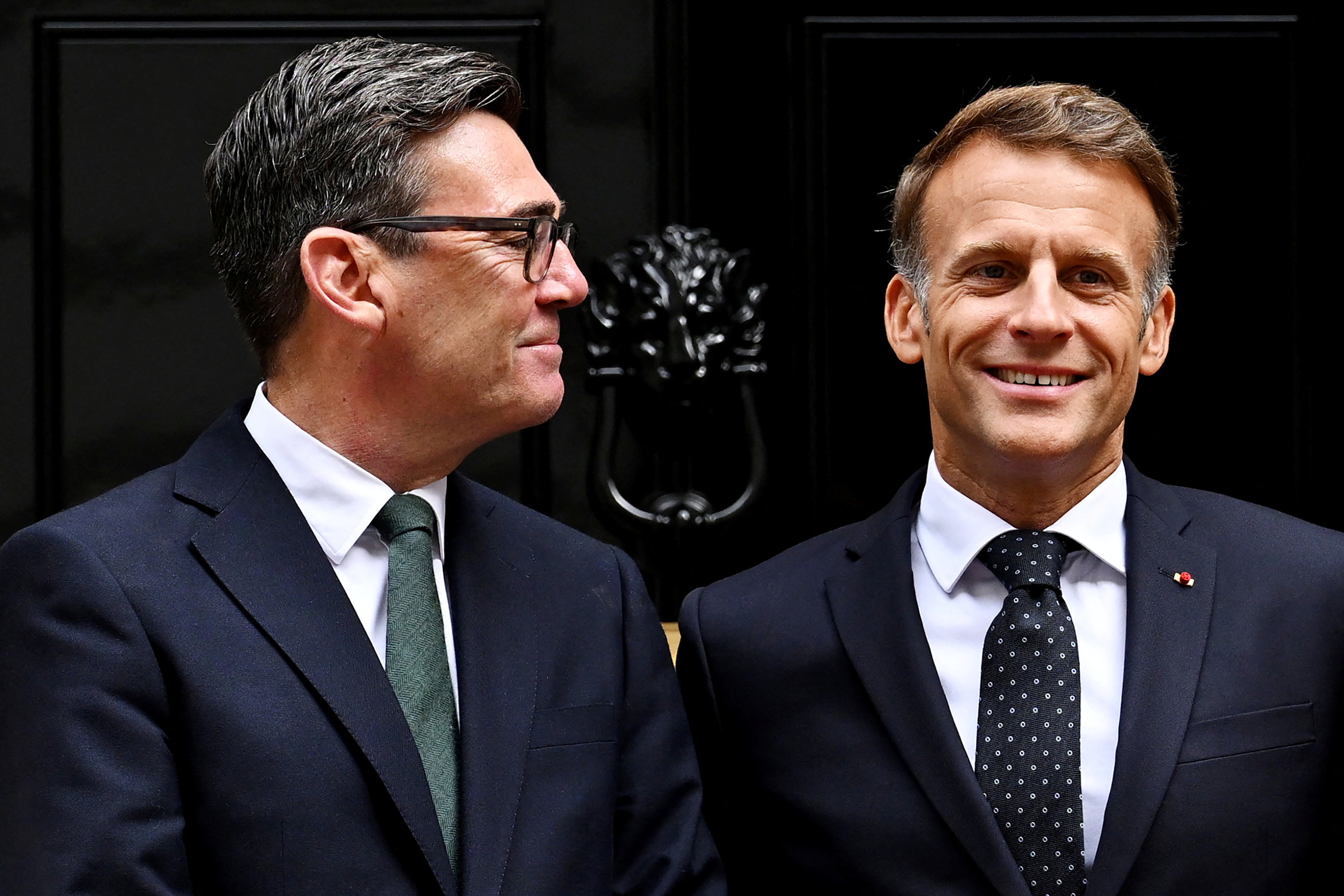 British Prime Minister Andy Burnham looks at French President Emmanuel Macron as they pose for photos ahead of a bilateral meeting at 10 Downing Street on September 3, 2026 in London, UK [Leon Neal/Reuters]